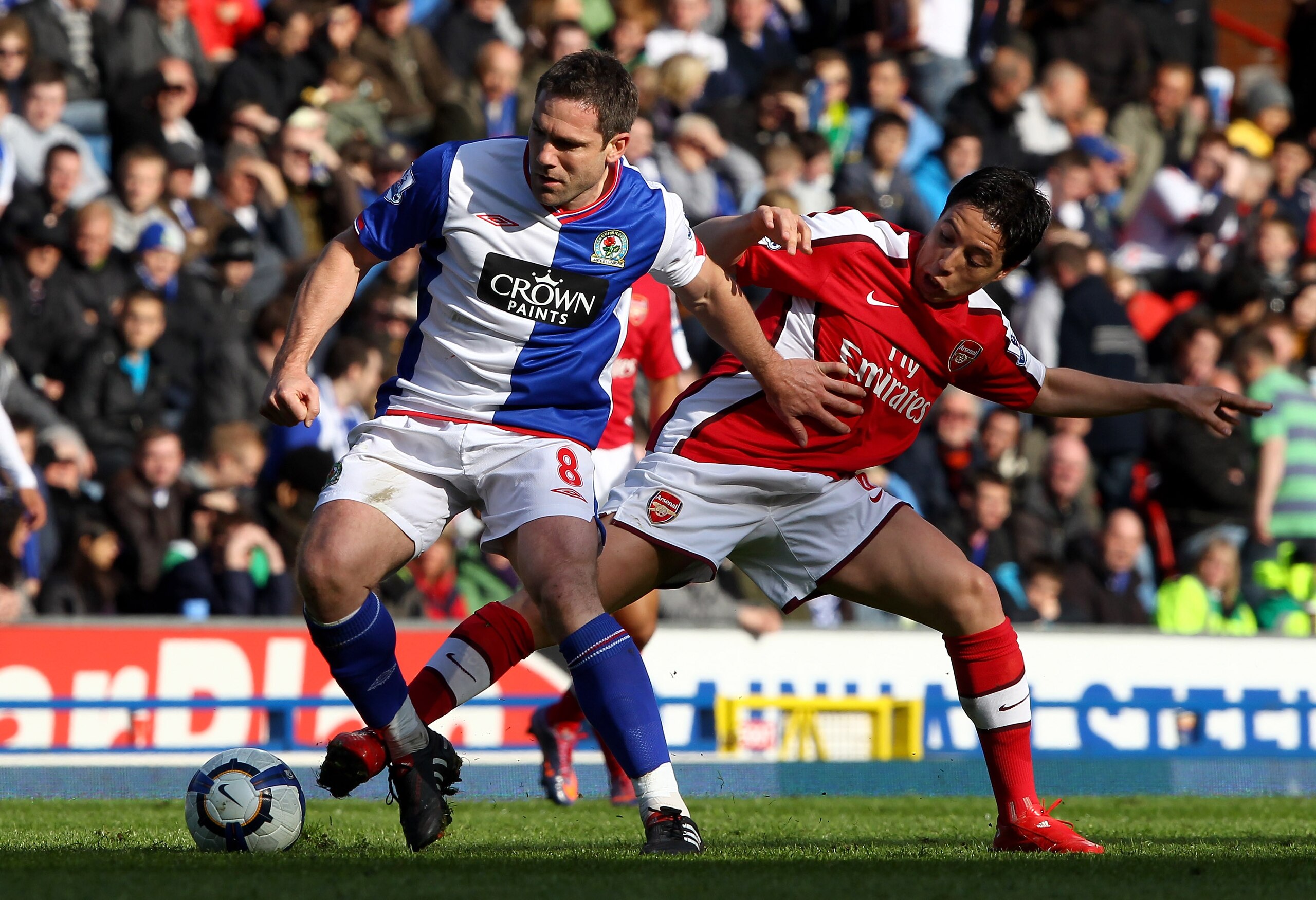 BLACKBURN, ENGLAND - MAY 03:  David Dunn of Blackburn Rovers holds off a challenge from Samir Nasri of Arsenal during the Barclays Premier League match between Blackburn Rovers and Arsenal at Ewood Park on May 3, 2010 in Blackburn, England.  (Photo by Cli