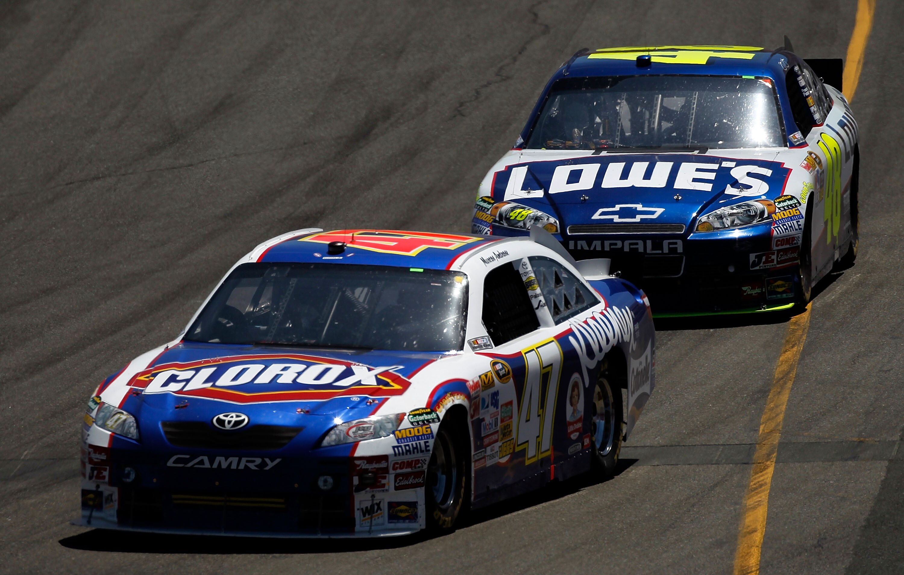 SONOMA, CA - JUNE 20:  Marcos Ambrose, driver of the #47 Clorox Toyota, leads Jimmie Johnson, driver of the #48 Lowe's Chevrolet, during the NASCAR Sprint Cup Series Toyota/Save Mart 350 at Infineon Raceway on June 20, 2010 in Sonoma, California.  (Photo 