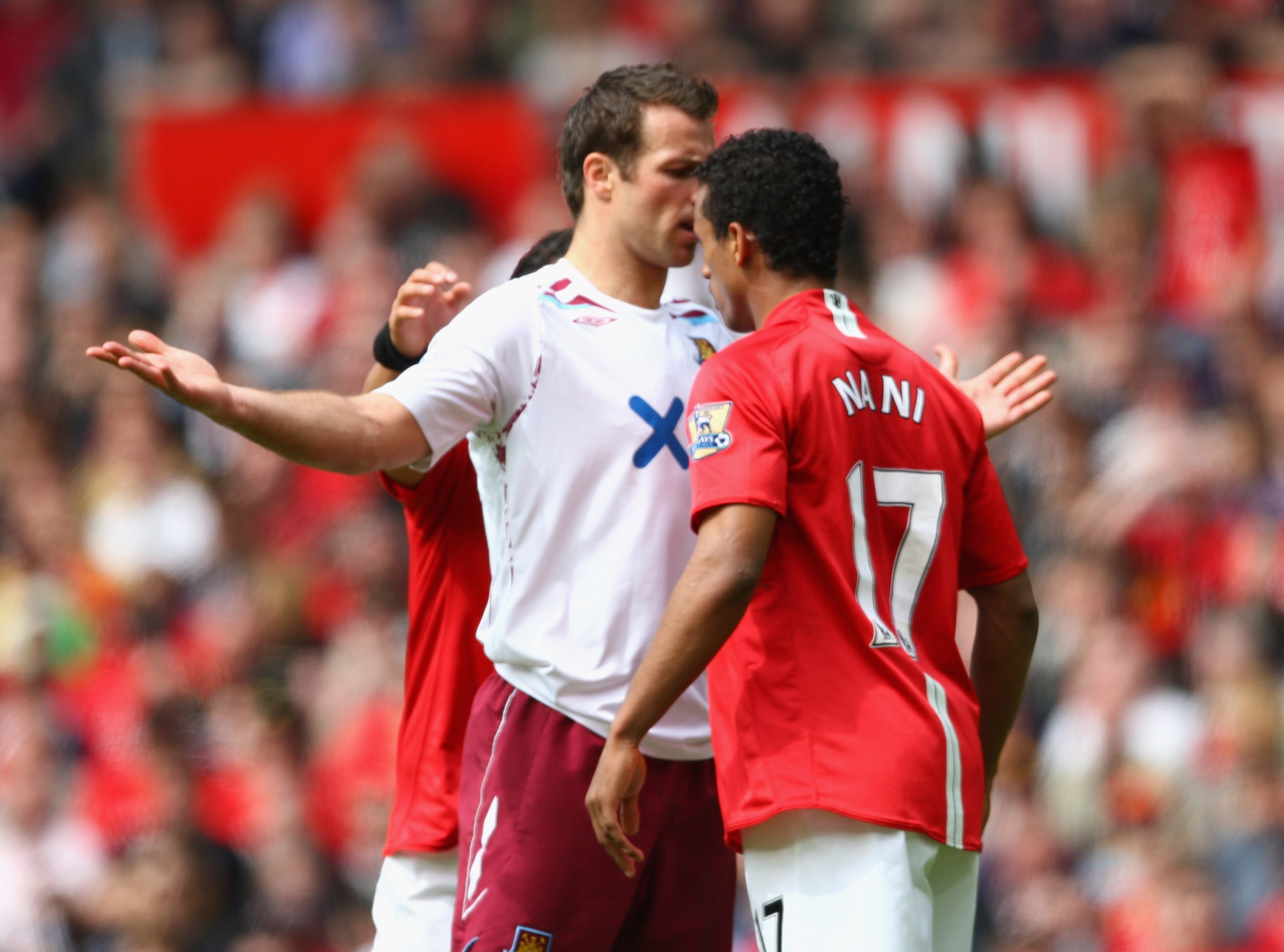 MANCHESTER, UNITED KINGDOM - MAY 03:  Lucas Neill of West Ham United squares up to Nani of Manchester United (R) during the Barclays Premier League match between Manchester United and West Ham United at Old Trafford on May 3, 2008 in Manchester, England. 