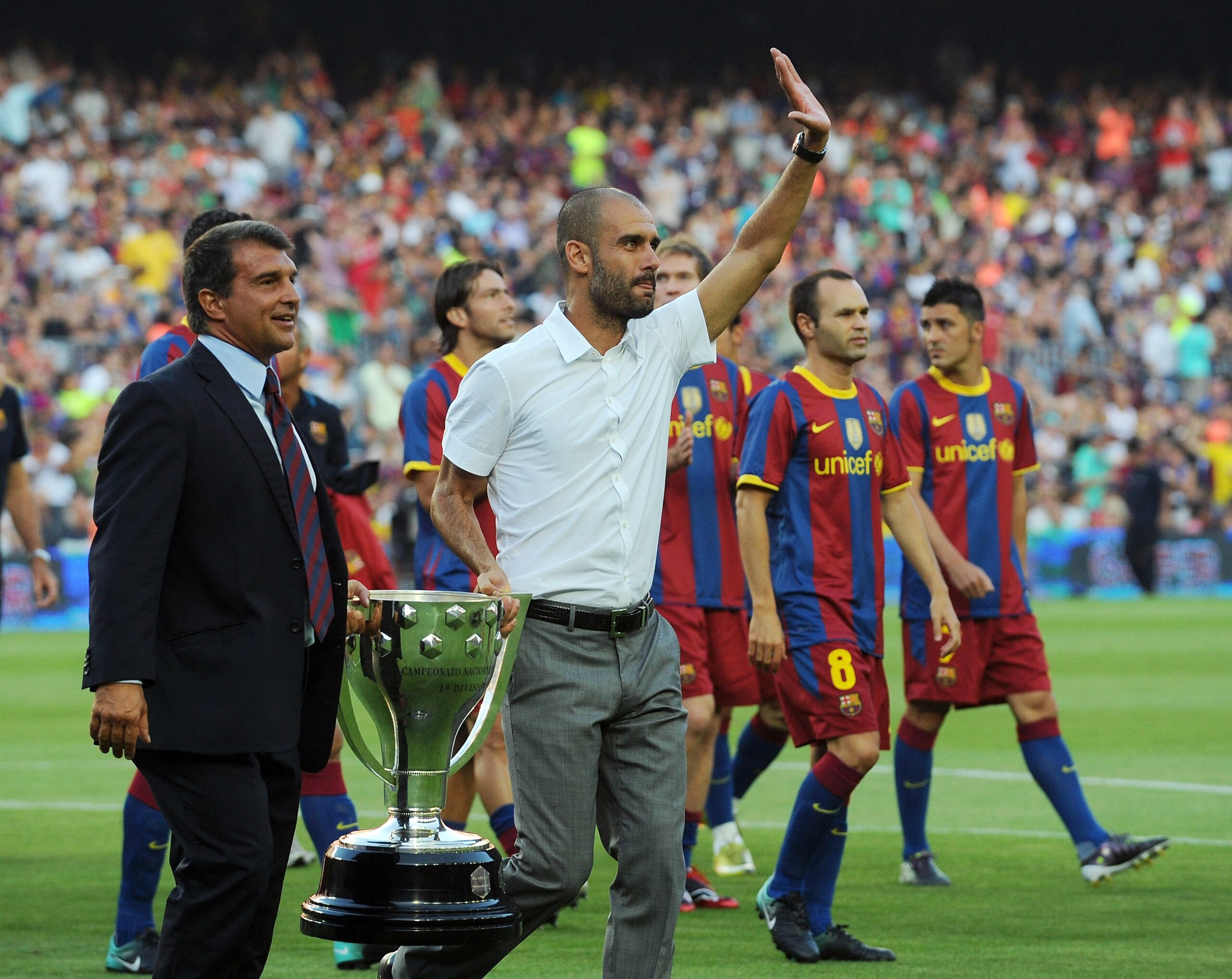 BARCELONA, SPAIN - AUGUST 25:  Former Barcelona president Joan Laparta (L) holds the 2009-2010 La Liga trophy with Barcelona manager Josep Guardiola during a lap of honour before the Joan Gamper Trophy match between Barcelona and AC Milan at Camp Nou stad