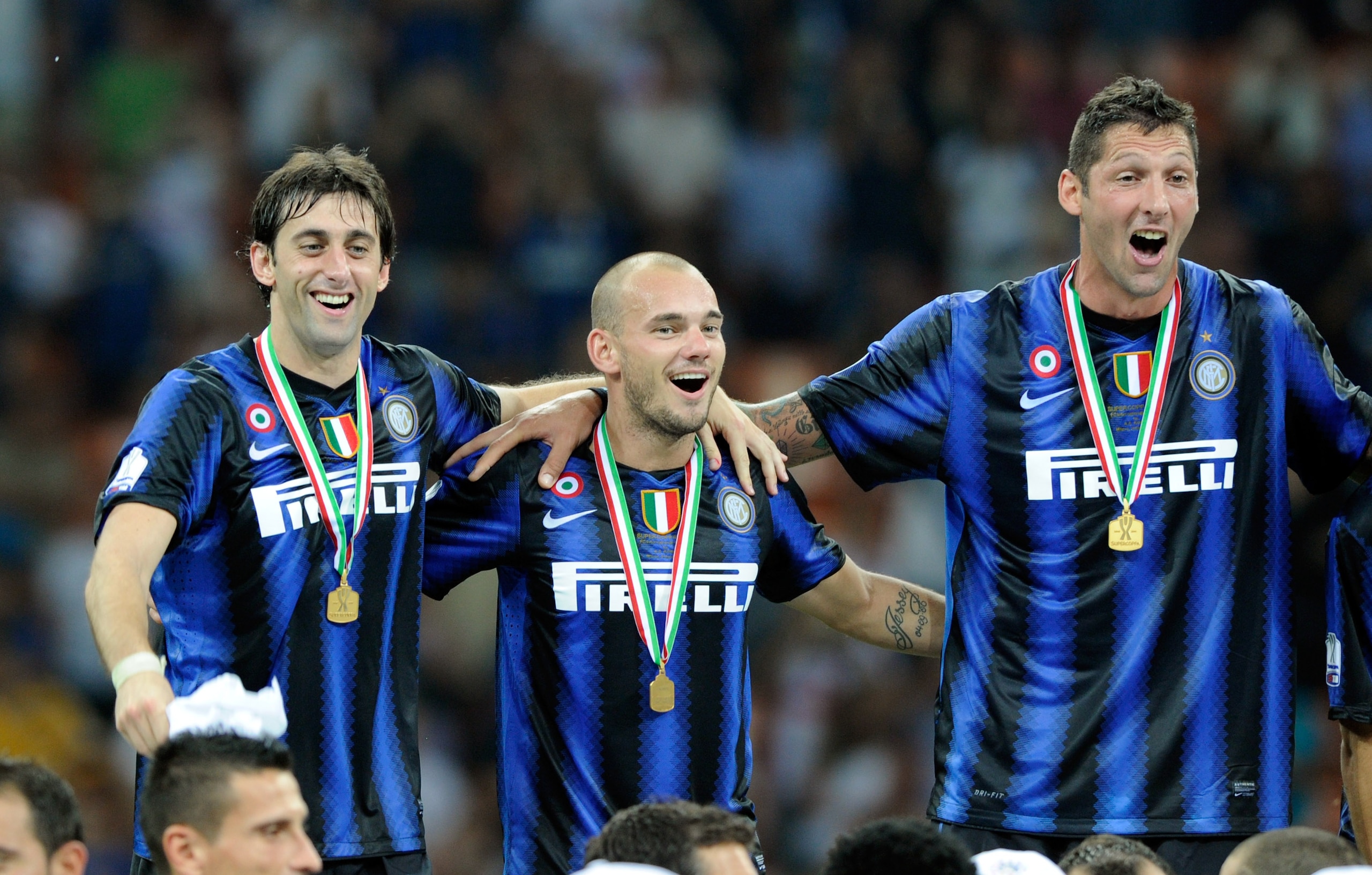 MILAN, ITALY - AUGUST 21:  Diego Alberto Milito, Wesley Sneijder and Marco Materazzi of FC Internazionale Milano celebrate after the Supercoppa Italiana match between Inter and Roma at Giuseppe Meazza Stadium on August 21, 2010 in Milan, Italy.  (Photo by