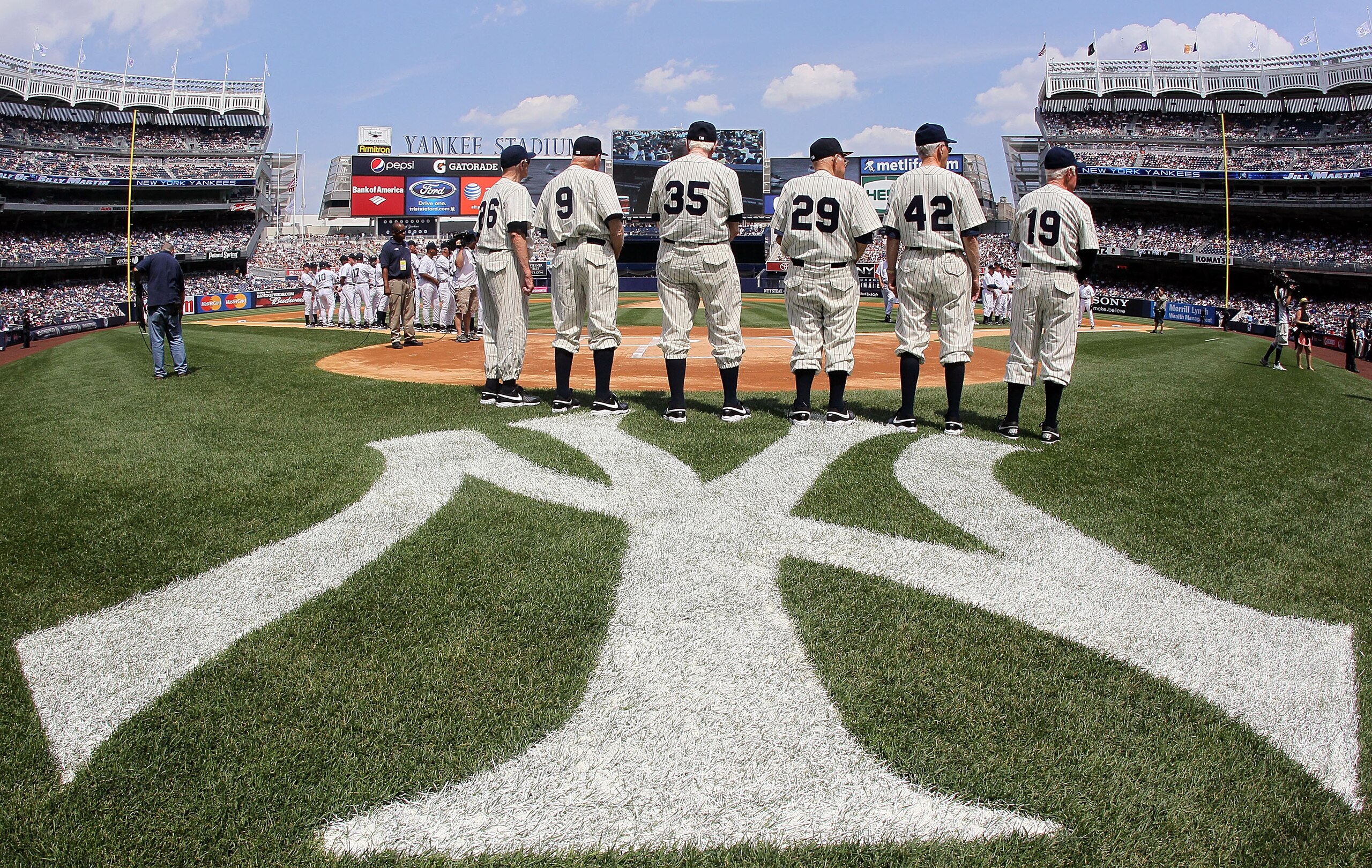 NEW YORK - JULY 17:  Members of the New York Yankees 1950 World Series championship team stand during ceremonies prior to the start of the teams 64th Old-Timer's Day before the MLB game against the Tampa Bay Rays on July 17, 2010 at Yankee Stadium in the