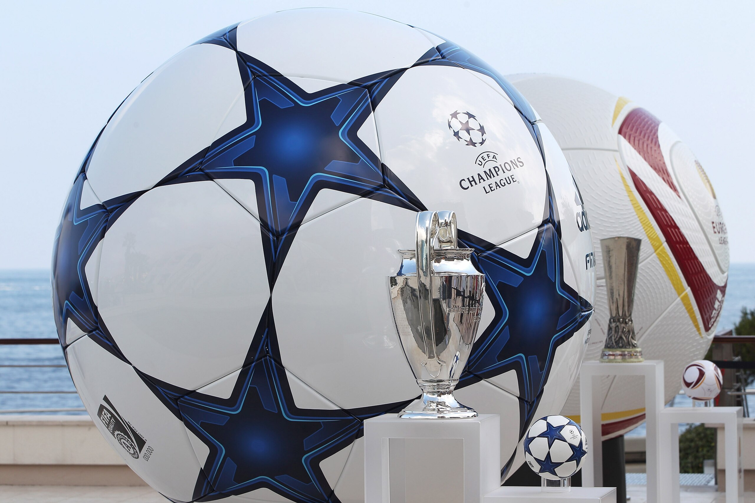 MONACO - AUGUST 26:  Adidas balls on show alongside the three main European club trophies, the Champions League, Europa League and Super Cup during the UEFA Champions League Group Stage draw at the Grimaldi Forum on August 26, 2010 in Monaco, Monaco.  (Ph