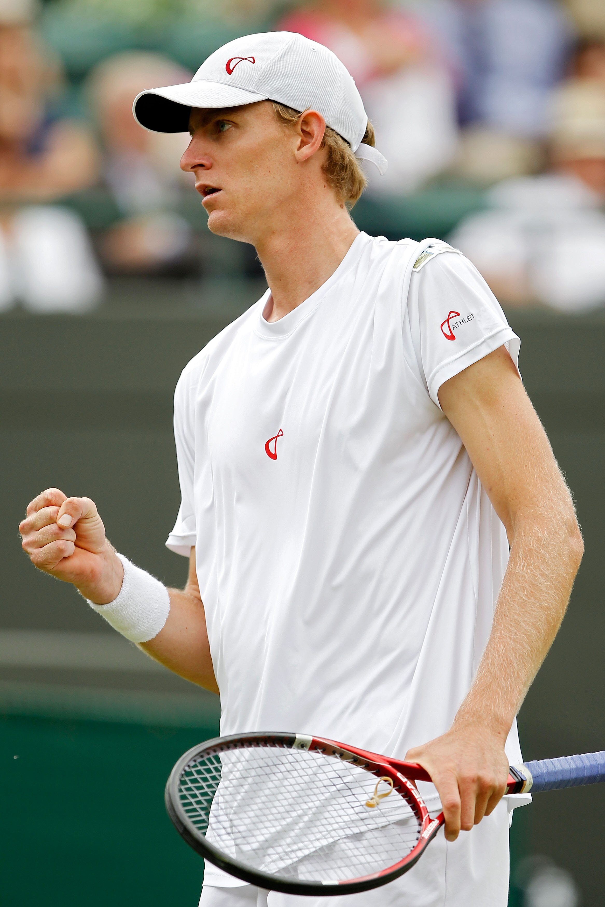 LONDON, ENGLAND - JUNE 21:  Nikolay Davydenko of Russia plays a shot during his first round match against Kevin Anderson of South Africa on Day One of the Wimbledon Lawn Tennis Championships at the All England Lawn Tennis and Croquet Club on June 21, 2010