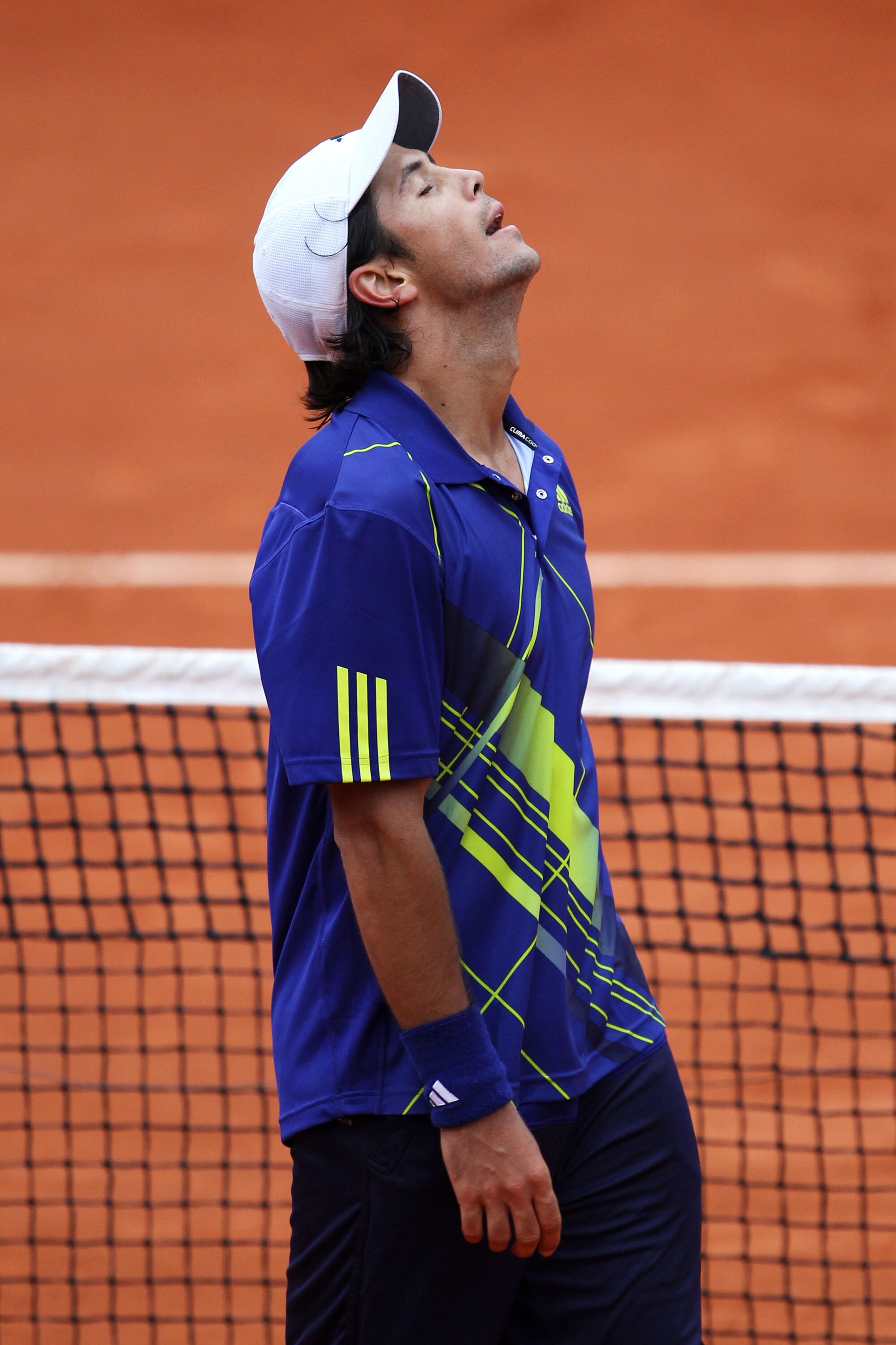 PARIS - MAY 29:  Fernando Verdasco of Spain shows his relief as he celebrates match point during the men's singles third round match between Fernando Verdasco of Spain and Philipp Kohlschreiber of Germany on day seven of the French Open at Roland Garros o