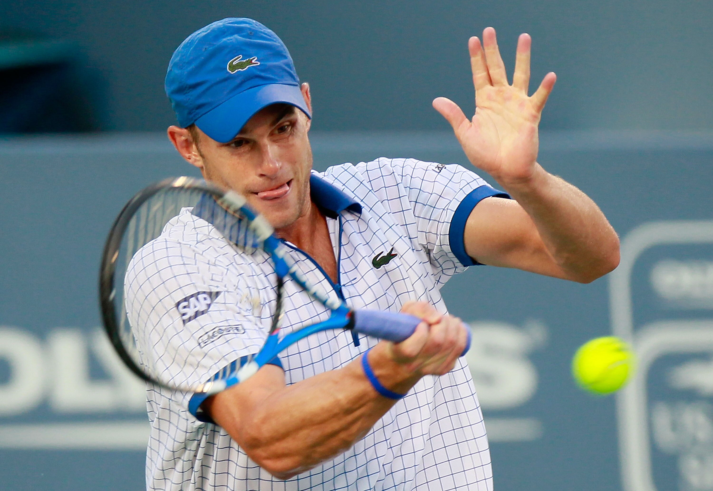 CINCINNATI - AUGUST 19:  Andy Roddick returns a forehand to Robin Soderling of Sweden during Day 4 of the Western & Southern Financial Group Masters at the Lindner Family Tennis Center on August 19, 2010 in Cincinnati, Ohio.  (Photo by Kevin C. Cox/Getty 
