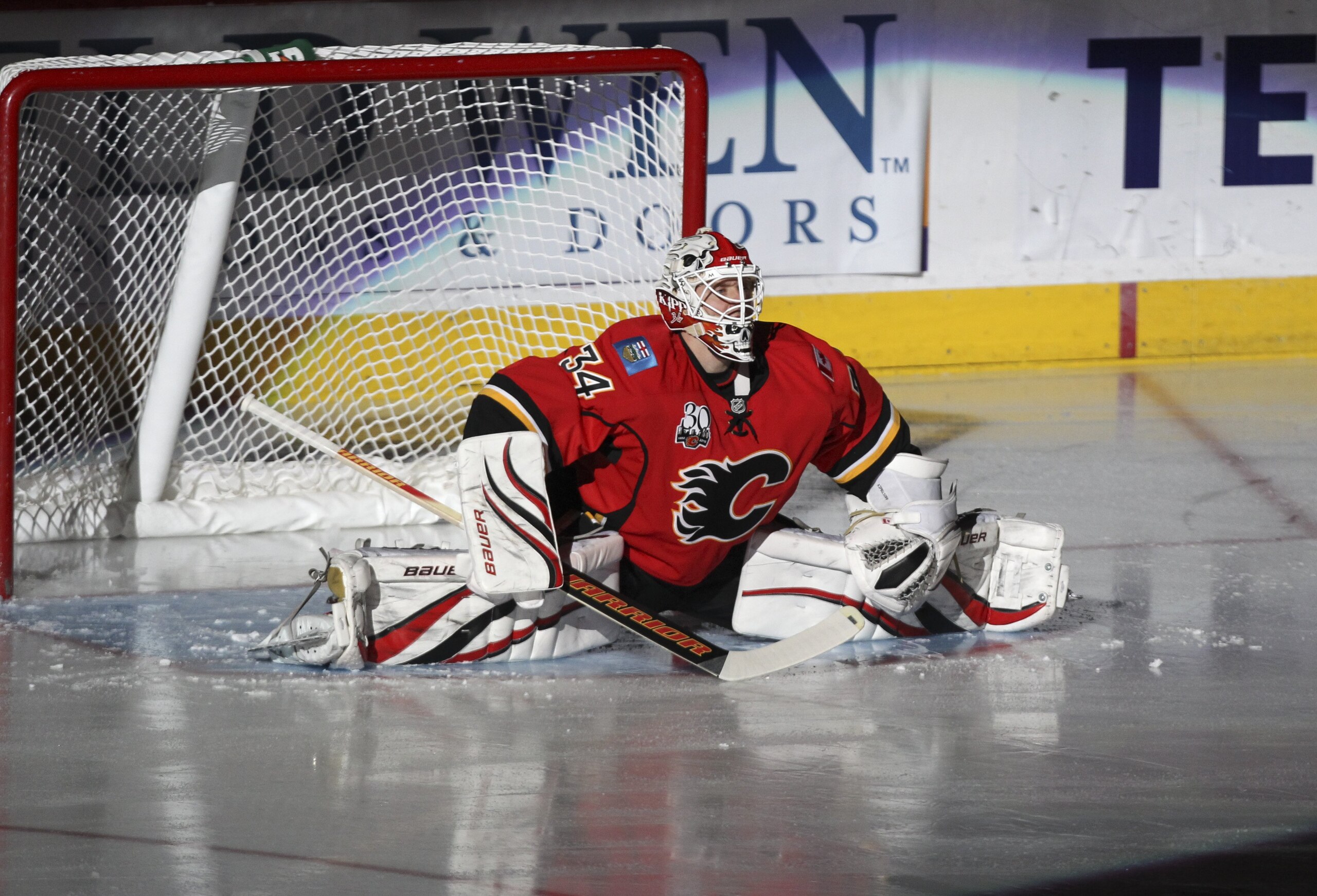 CALGARY, AB -APRIL 6: Miikka Kiprusoff #34 of the Calgary Flames stretches as he is introduced before playing the San Jose Sharks in the NHL game on April 6, 2010 at the Pengrowth Saddledome in Calgary, Alberta. (Photo by Mike Ridewood/Getty Images)