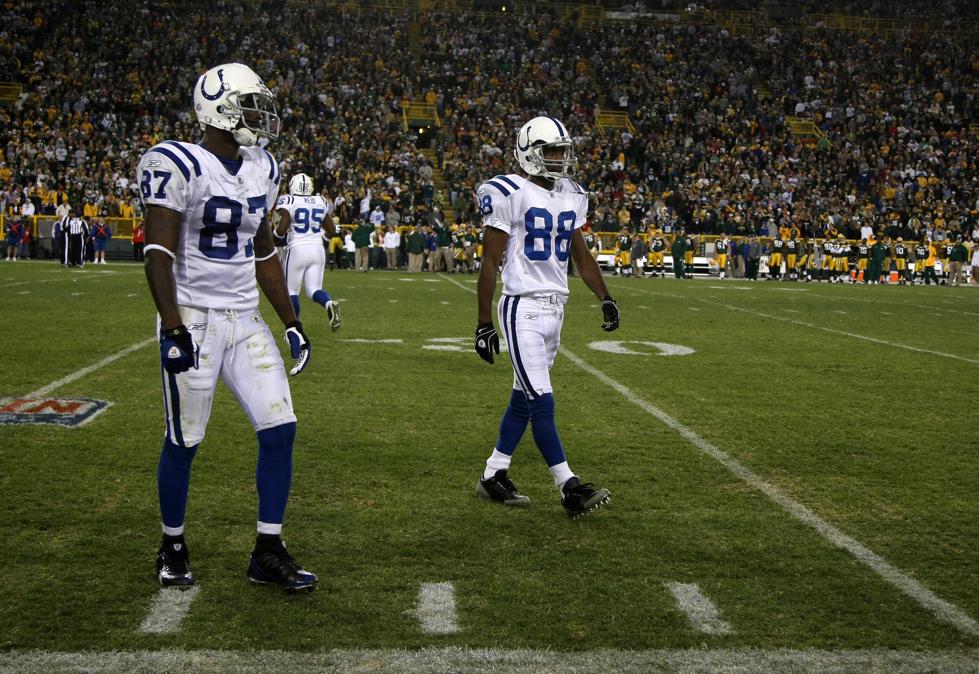 GREEN BAY, WI - OCTOBER 19: Wide receivers Reggie Wayne #87 and Marvin Harrison #88 of the Indianapolis Colts come off the field during the game with the Green Bay Packers on October 19, 2008 at Lambeau Field in Green Bay Wisconsin. The Packers won 34-14.