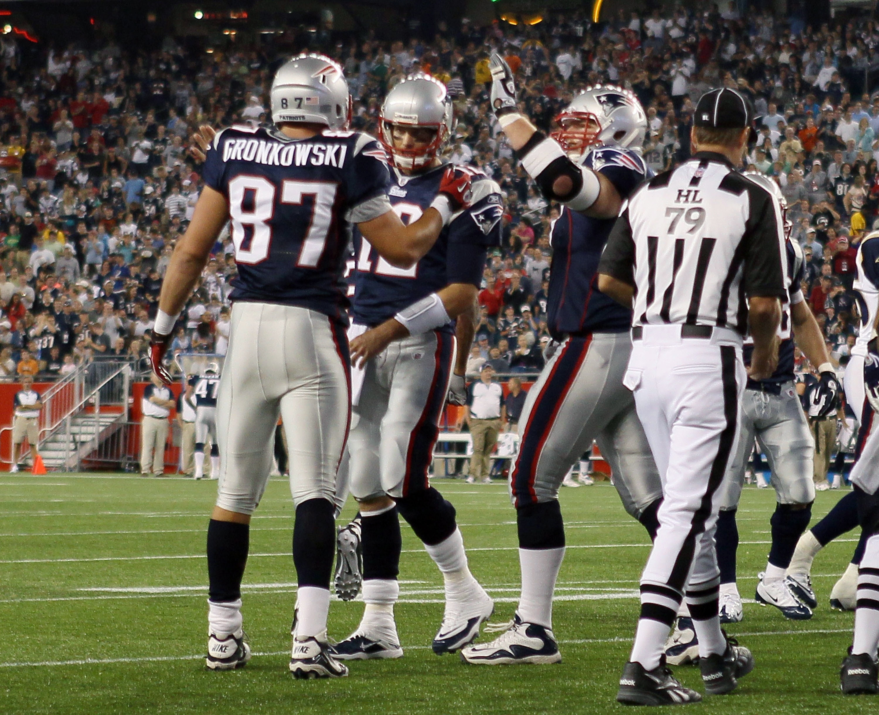 FOXBORO, MA - AUGUST 26:  Tom Brady #12 of the New England Patriots celebrates the touchdown with Rob Gronkowski #87 in the second quarter against the St. Louis Rams on August 26, 2010 at Gillette Stadium in Foxboro, Massachusetts.  (Photo by Elsa/Getty I
