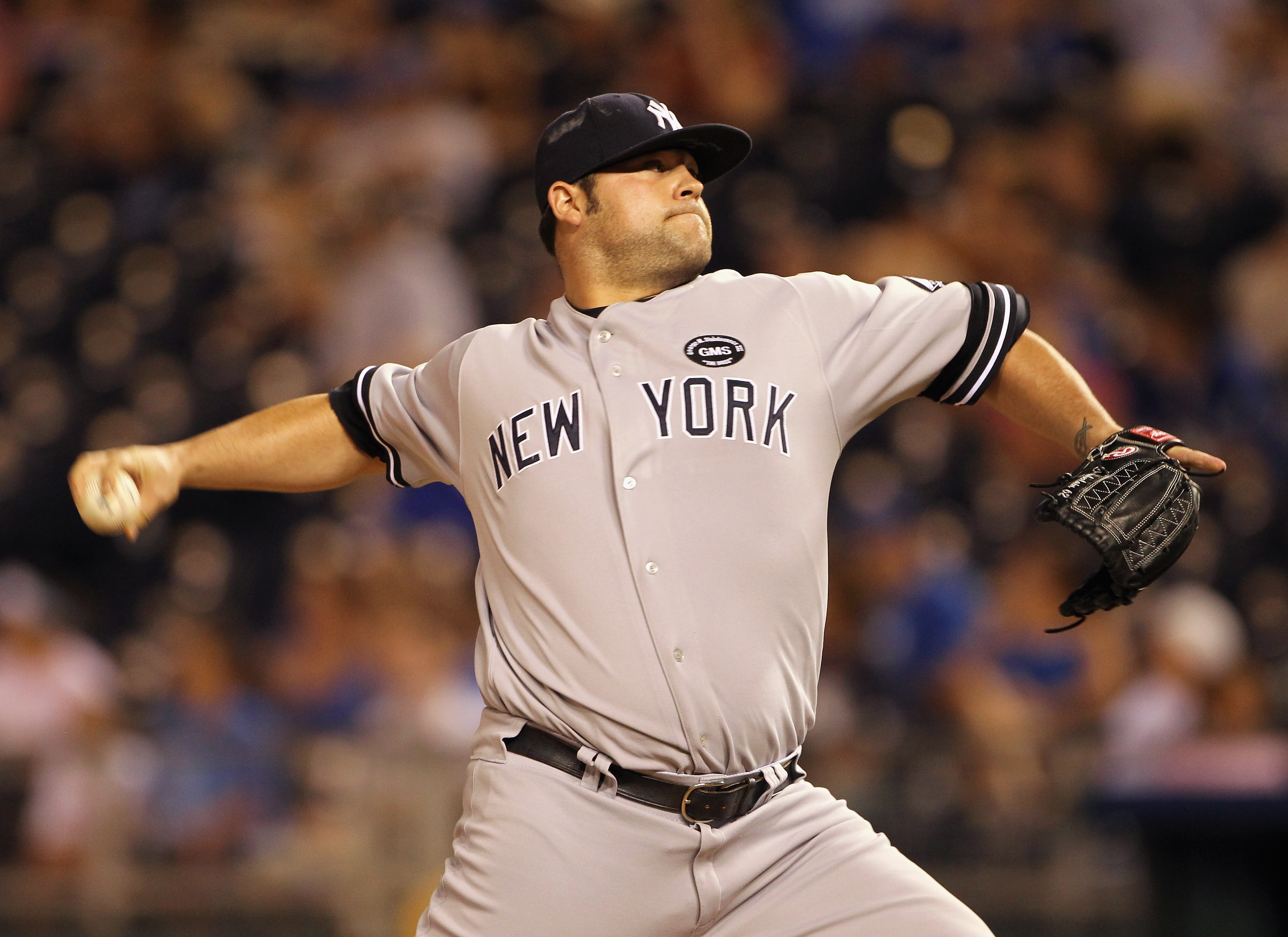 KANSAS CITY, MO - AUGUST 13:  Pitcher Joba Chamberlain #62 of the New York Yankees pitches during the game against the Kansas City Royals on August 13, 2010 at Kauffman Stadium in Kansas City, Missouri.  (Photo by Jamie Squire/Getty Images)