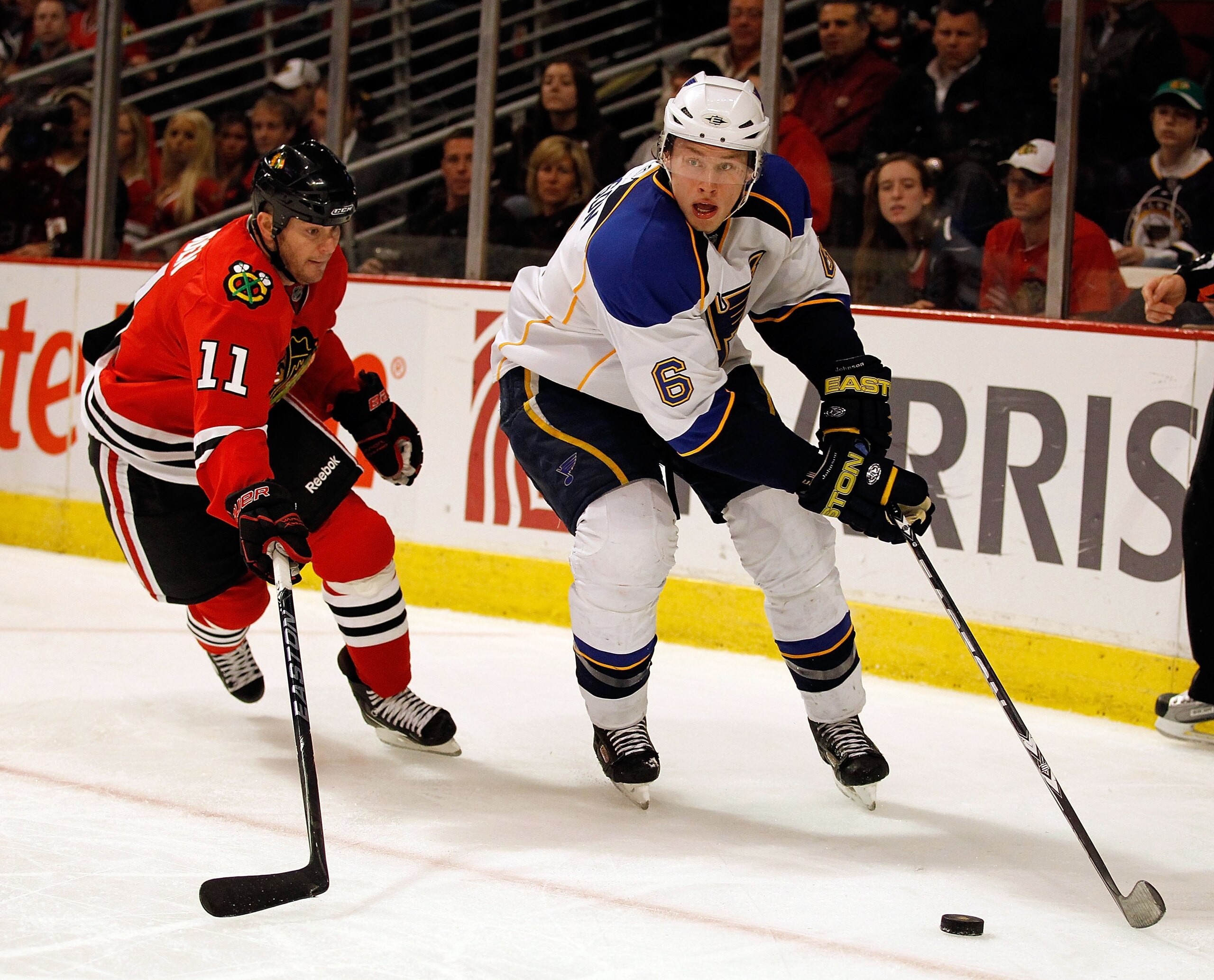 CHICAGO - APRIL 07: Erik Johnson #6 of the St. Louis Blues controls down the puck under pressure from John Madden #11 of the Chicago Blackhawks at the United Center on April 7, 2010 in Chicago, Illinois. The Blackhawks defeated the Blues 6-5. (Photo by Jo CHICAGO - APRIL 07: Erik Johnson #6 of the St. Louis Blues controls down the puck under pressure from John Madden #11 of the Chicago Blackhawks at the United Center on April 7, 2010 in Chicago, Illinois. The Blackhawks defeated the Blues 6-5. (Photo by Jo