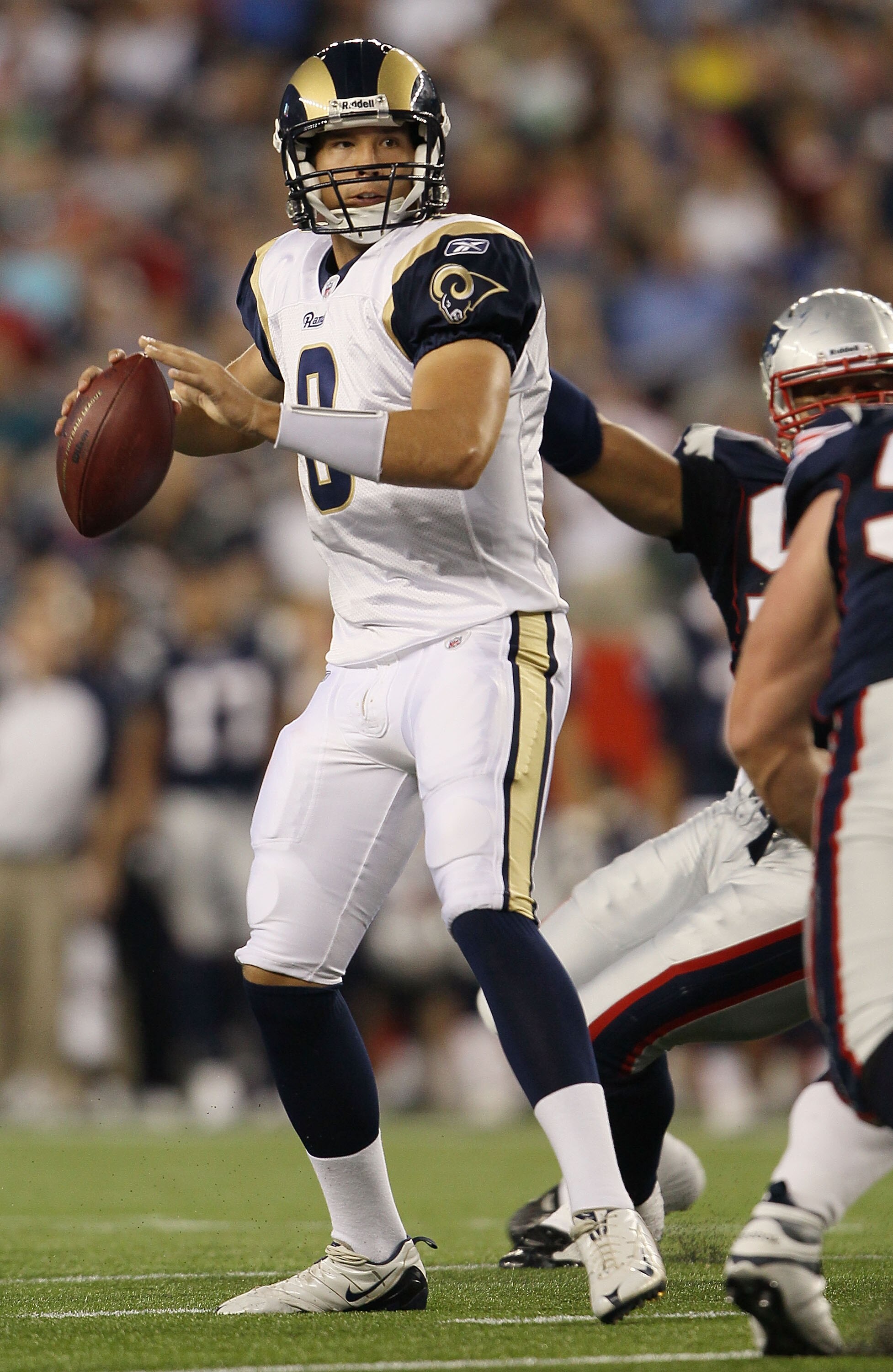 FOXBORO, MA - AUGUST 26:  Sam Bradford #8 of the St. Louis Rams looks to pass in the first half against the New England Patriots on August 26, 2010 at Gillette Stadium in Foxboro, Massachusetts.  (Photo by Elsa/Getty Images)