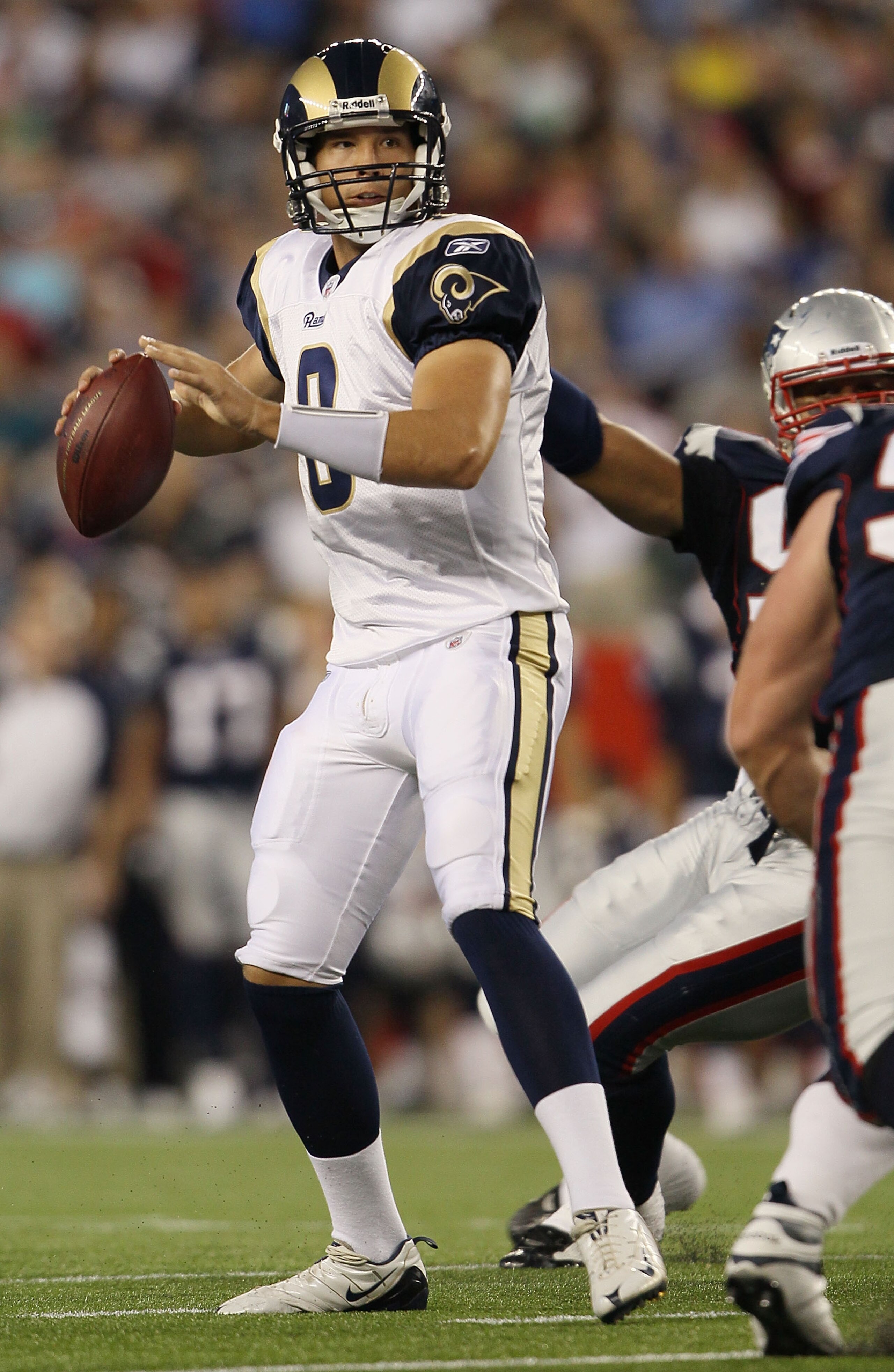 FOXBORO, MA - AUGUST 26:  Sam Bradford #8 of the St. Louis Rams looks to pass in the first half against the New England Patriots on August 26, 2010 at Gillette Stadium in Foxboro, Massachusetts.  (Photo by Elsa/Getty Images)