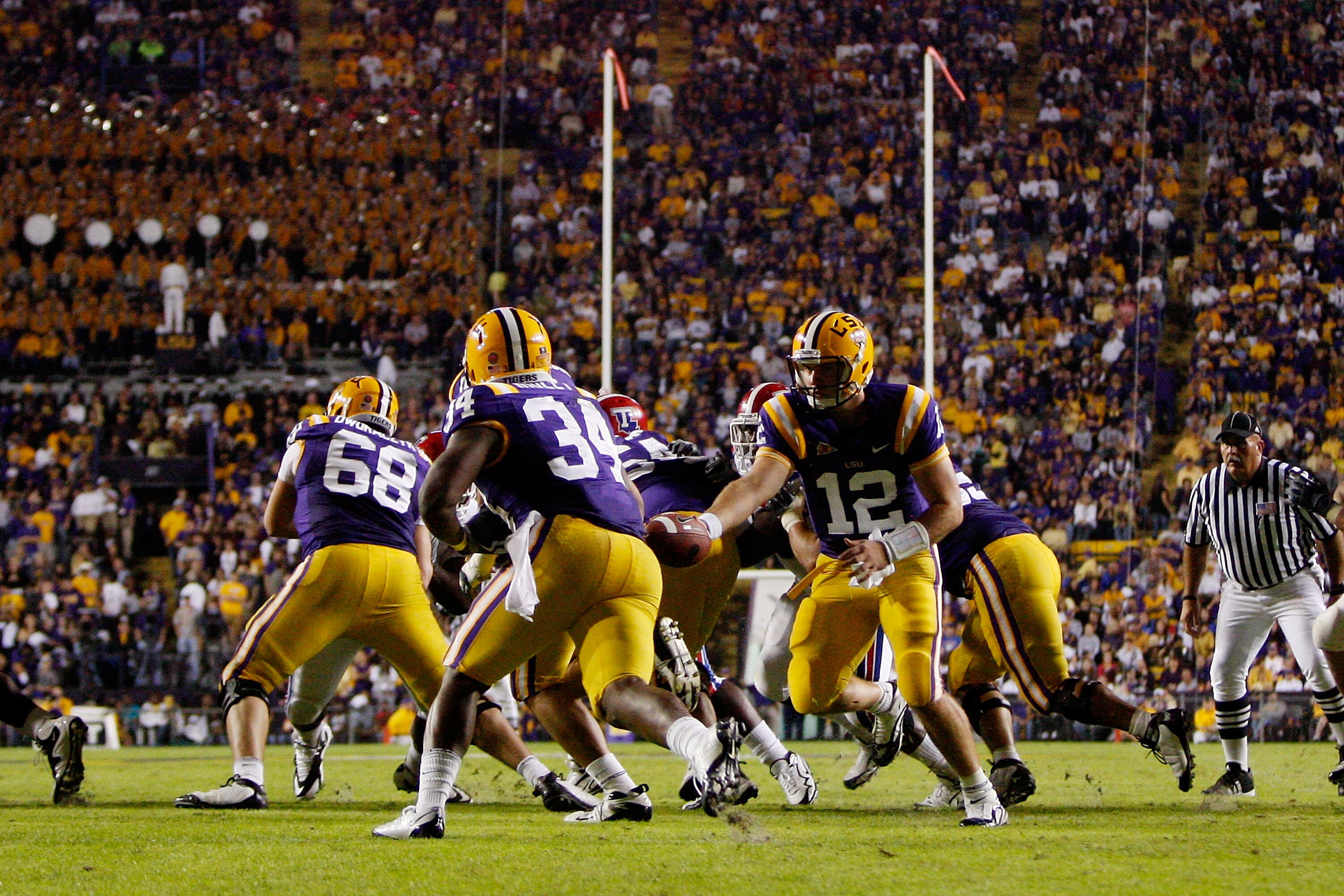 BATON ROUGE, LA - NOVEMBER 14:  Quarterback Jarrett Lee #12 of the LSU Tigers hands off the ball to Stevan Ridley #34 during the game against the Louisiana Tech Bulldogs at Tiger Stadium on November 14, 2009 in Baton Rouge, Louisiana.  The Tigers defeated