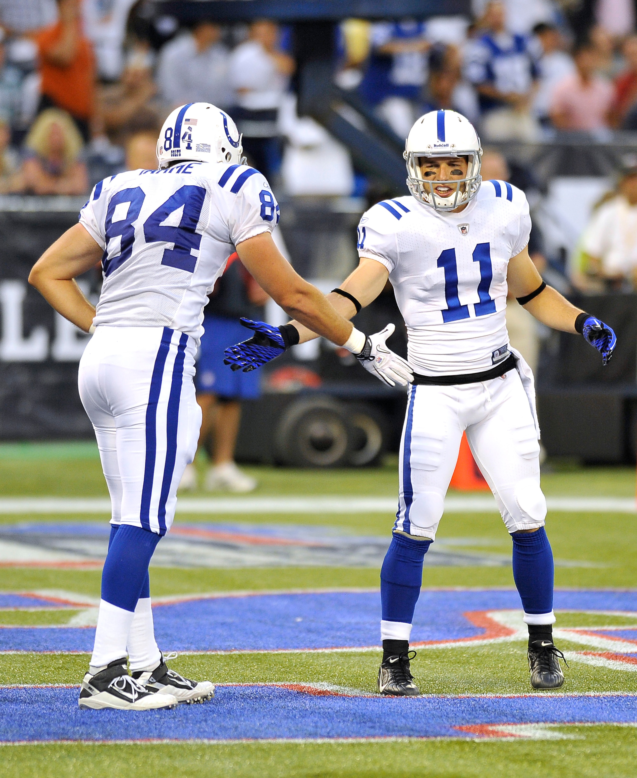 TORONTO, CANADA - AUGUST 19: Jacob Tamme #84 and Anthony Gonzalez #11 of the Indianapolis Colts shake hands during a break in game action against the Buffalo Bills on August 19, 2010 at the Rogers Centre in Toronto, Ontario, Canada. (Photo by Brad White/G TORONTO, CANADA - AUGUST 19: Jacob Tamme #84 and Anthony Gonzalez #11 of the Indianapolis Colts shake hands during a break in game action against the Buffalo Bills on August 19, 2010 at the Rogers Centre in Toronto, Ontario, Canada. (Photo by Brad White/G