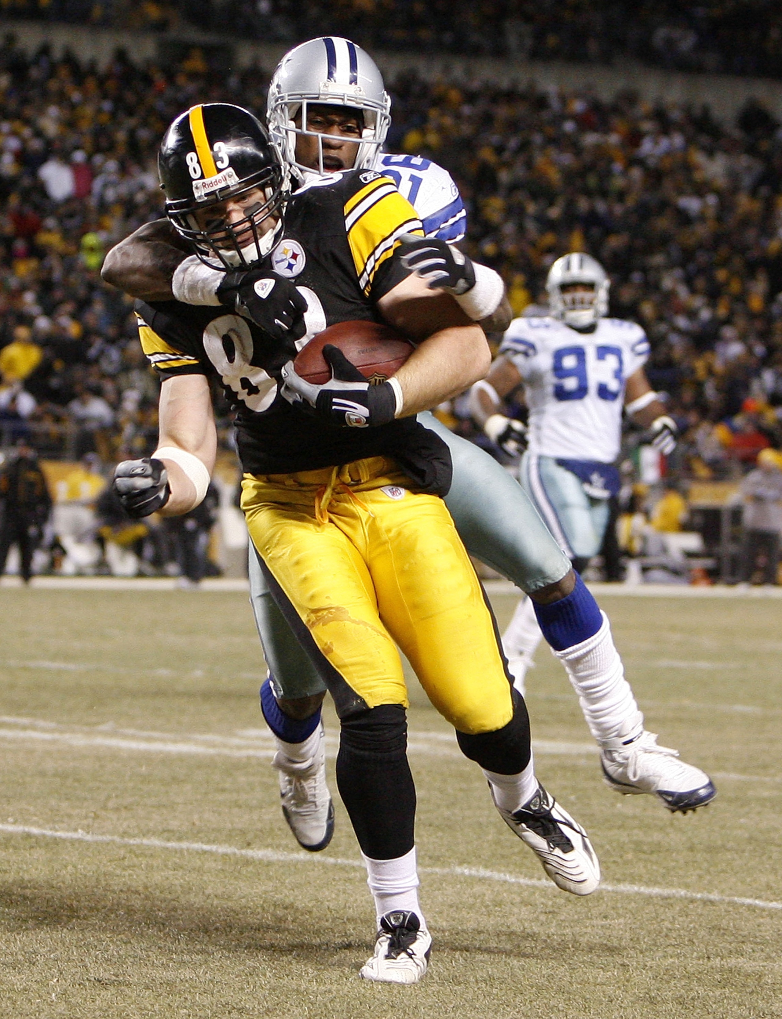 PITTSBURGH - DECEMBER 07:  Heath Miller #83 of the Pittsburgh Steelers carries Ken Hamlin #26 of the Dallas Cowboys on his back in for a fourth quarter touchdown on December 7, 2008 at Heinz Field in Pittsburgh, Pennsylvania.  Pittsburgh won the game 20-1