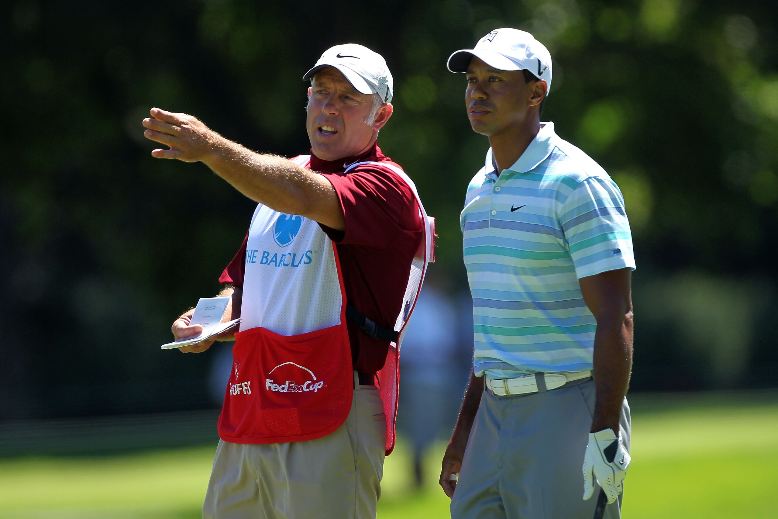PARAMUS, NJ - AUGUST 27:  Tiger Woods (R) talks with caddie Steve Williams on the 11th hole fairway during the second round of The Barclays at the Ridgewood Country Club on August 27, 2010 in Paramus, New Jersey.  (Photo by Hunter Martin/Getty Images)