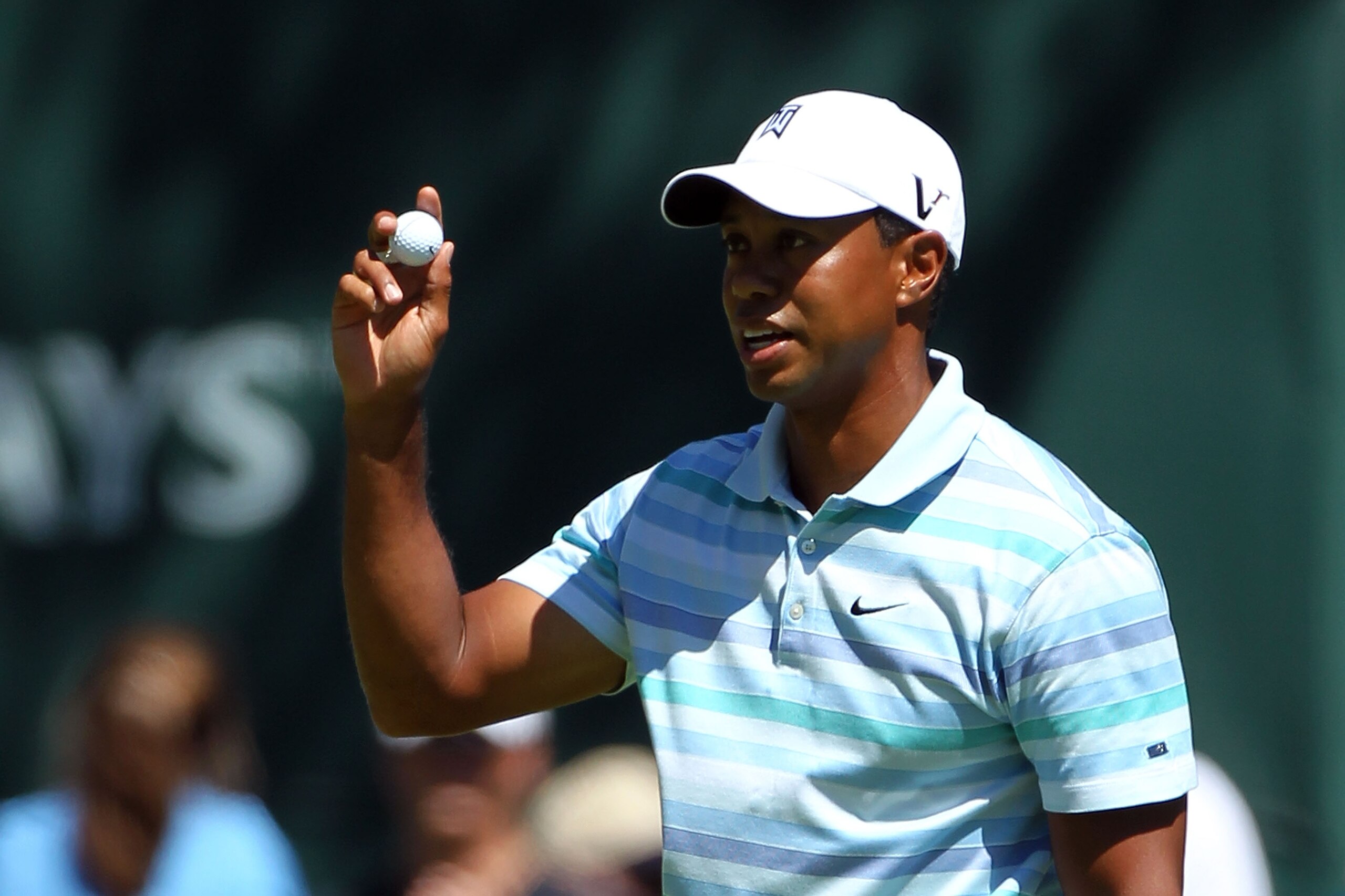 PARAMUS, NJ - AUGUST 27:  Tiger Woods holds up his ball in reaction to his birdie putt on the 11th green during the second round of The Barclays at the Ridgewood Country Club on August 27, 2010 in Paramus, New Jersey.  (Photo by Hunter Martin/Getty Images