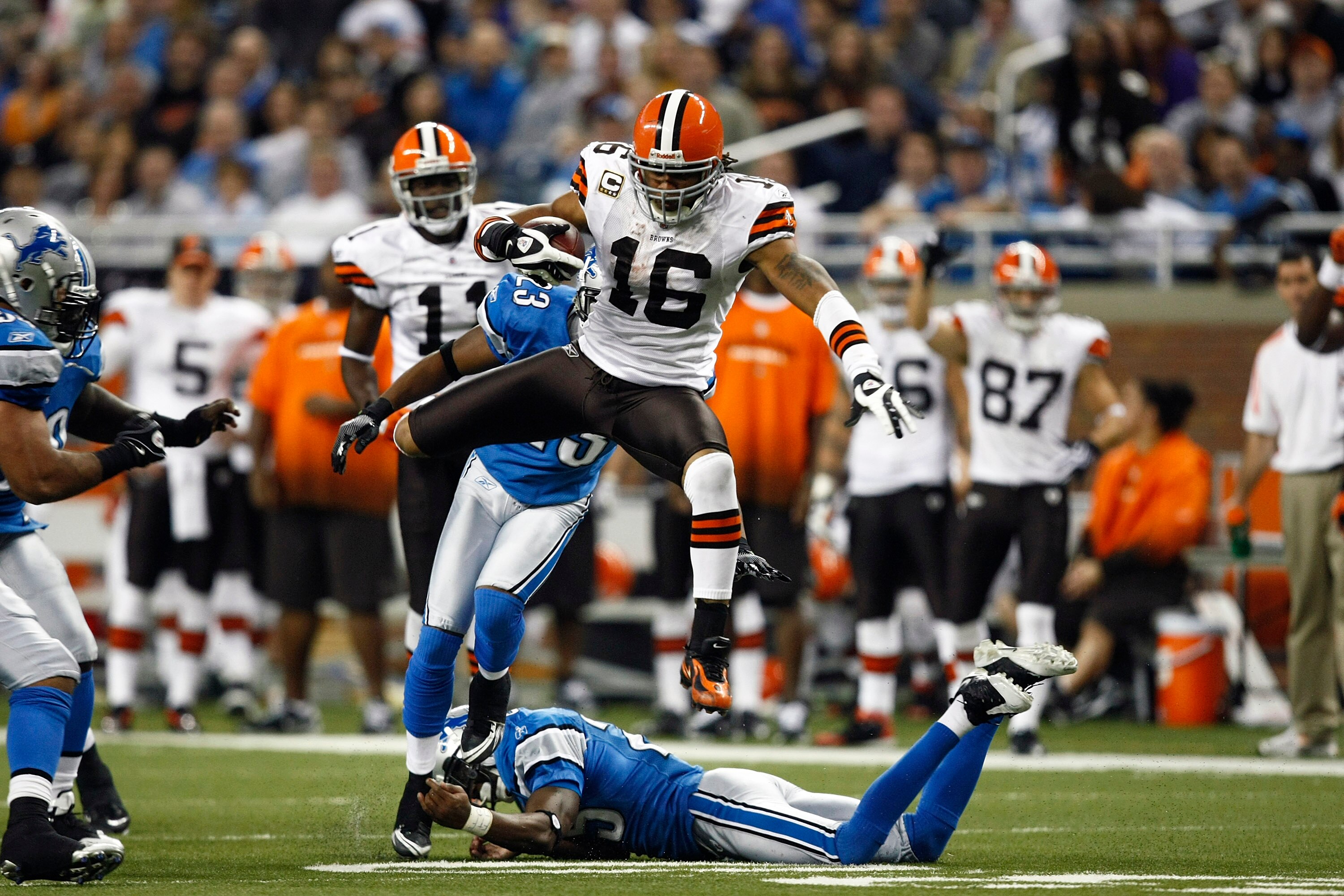 DETROIT, MI - NOVEMBER 22: Josh Cribbs #16 of the Cleveland Browns jumps over a defender while running with the football against the Detroit Lions at Ford Field on November 22, 2009 in Detroit, Michigan. The Lions came from behind to defeat the Browns 38-