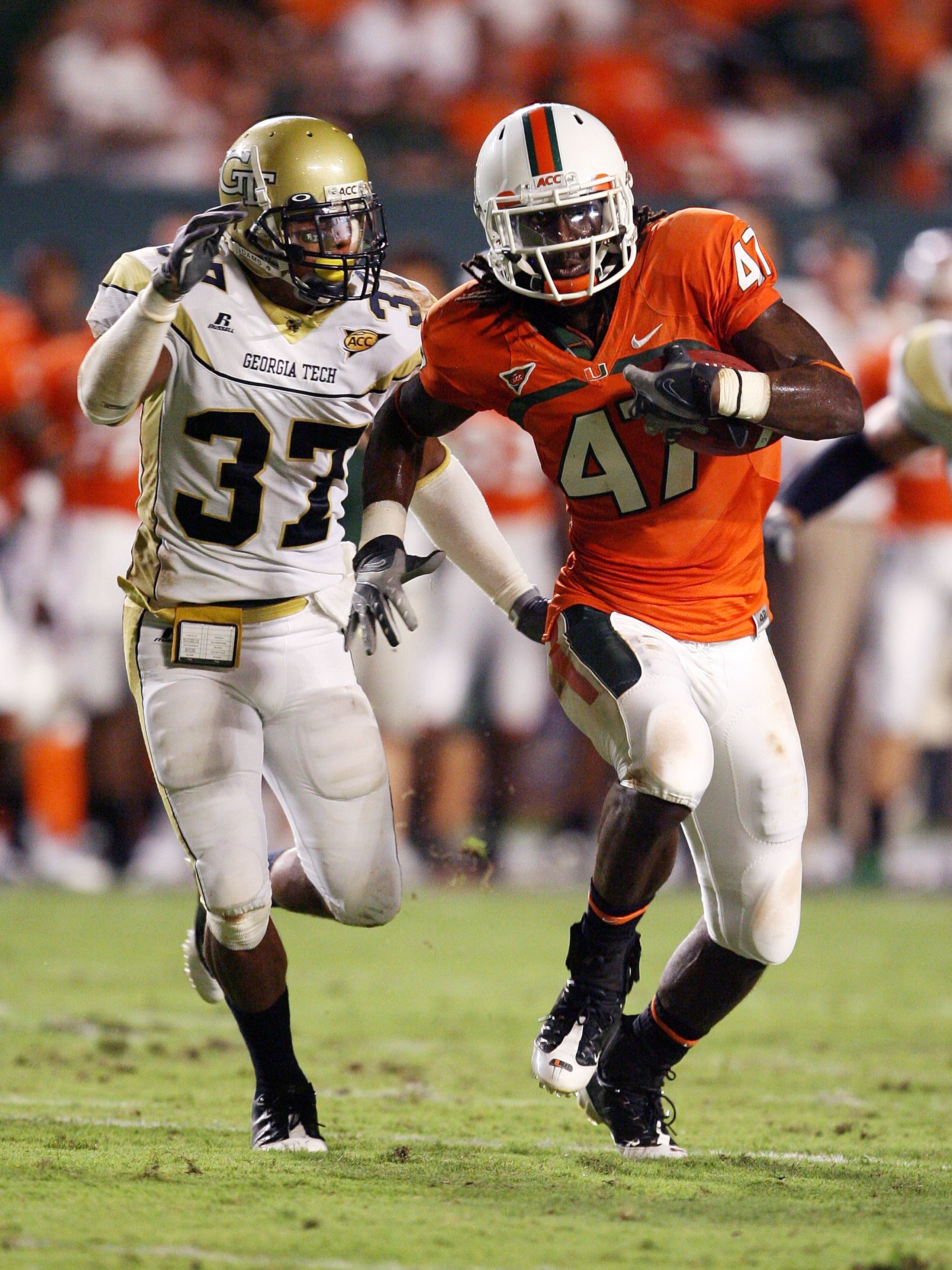 FORT LAUDERDALE, FL - SEPTEMBER 17:  Cornerback Jerrard Tarrant #37 Georgia Tech Yellow Jackets tries to chase down wide receiver LaRon Byrd #47 of the Miami Hurricanes at Land Shark Stadium on September 17, 2009 in Fort Lauderdale, Florida.  (Photo by Do