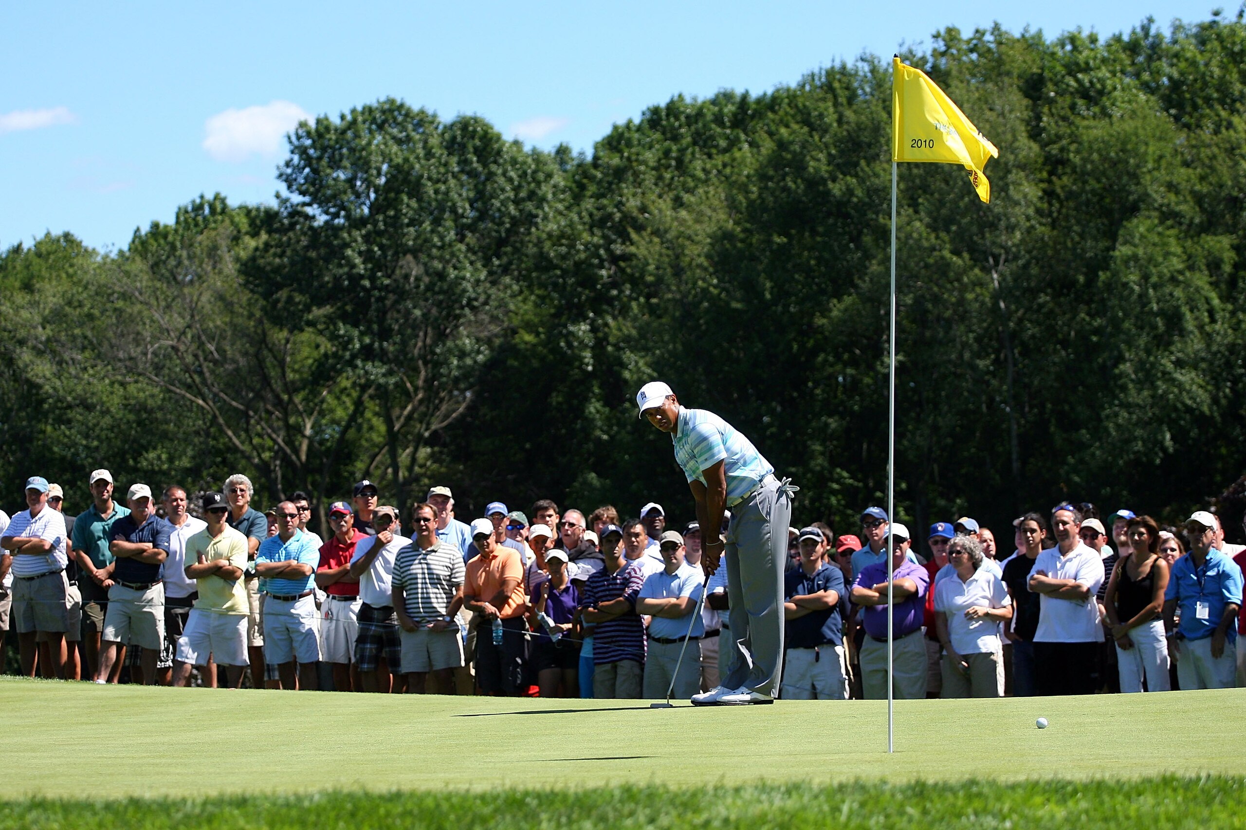 PARAMUS, NJ - AUGUST 27:  Tiger Woods lines up a putt attempt on the tenth green as fans keep a close watch during the second round of The Barclays at the Ridgewood Country Club on August 27, 2010 in Paramus, New Jersey.  (Photo by Hunter Martin/Getty Ima