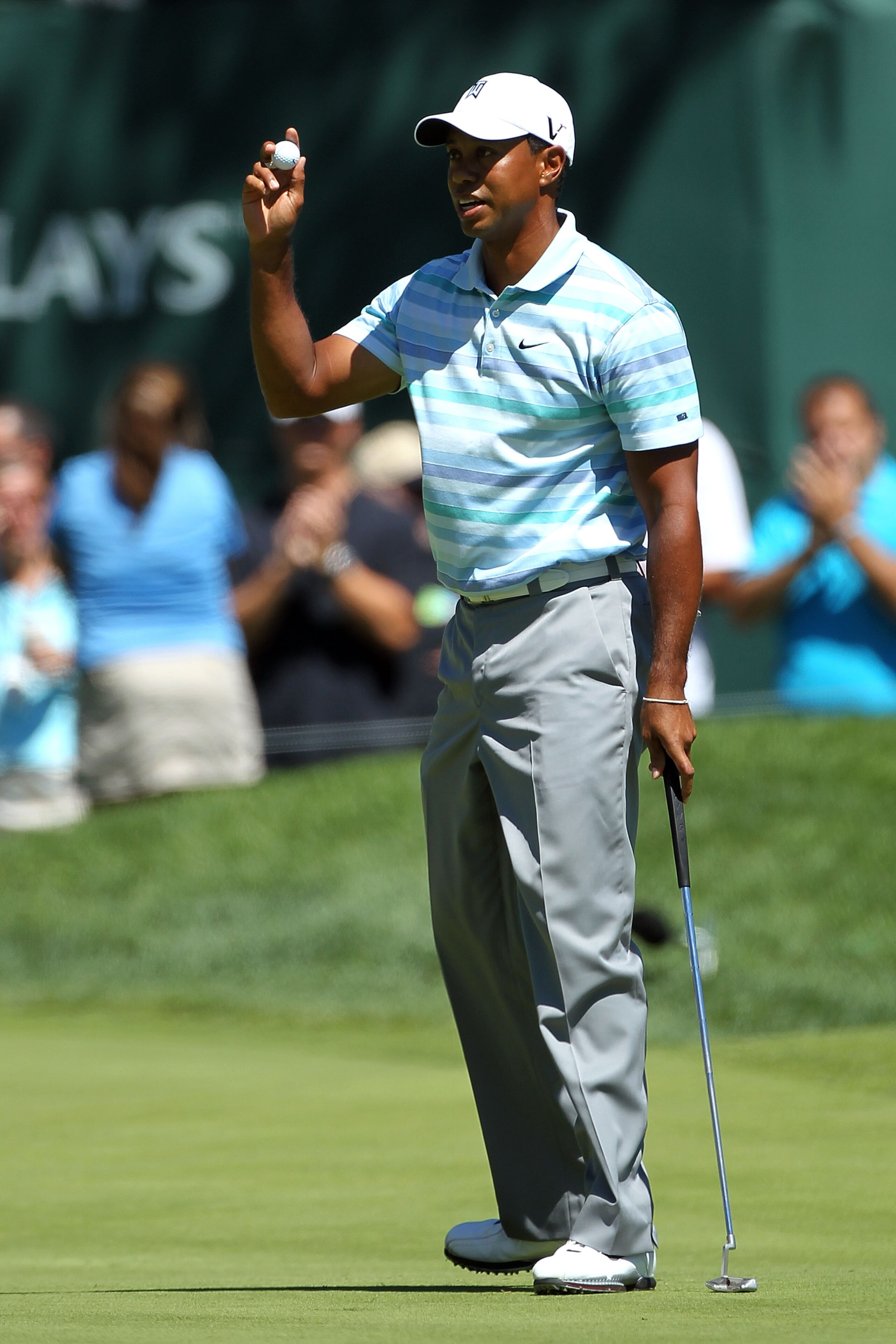 PARAMUS, NJ - AUGUST 27:  Tiger Woods holds up his ball in reaction to his birdie putt on the 11th green during the second round of The Barclays at the Ridgewood Country Club on August 27, 2010 in Paramus, New Jersey.  (Photo by Hunter Martin/Getty Images