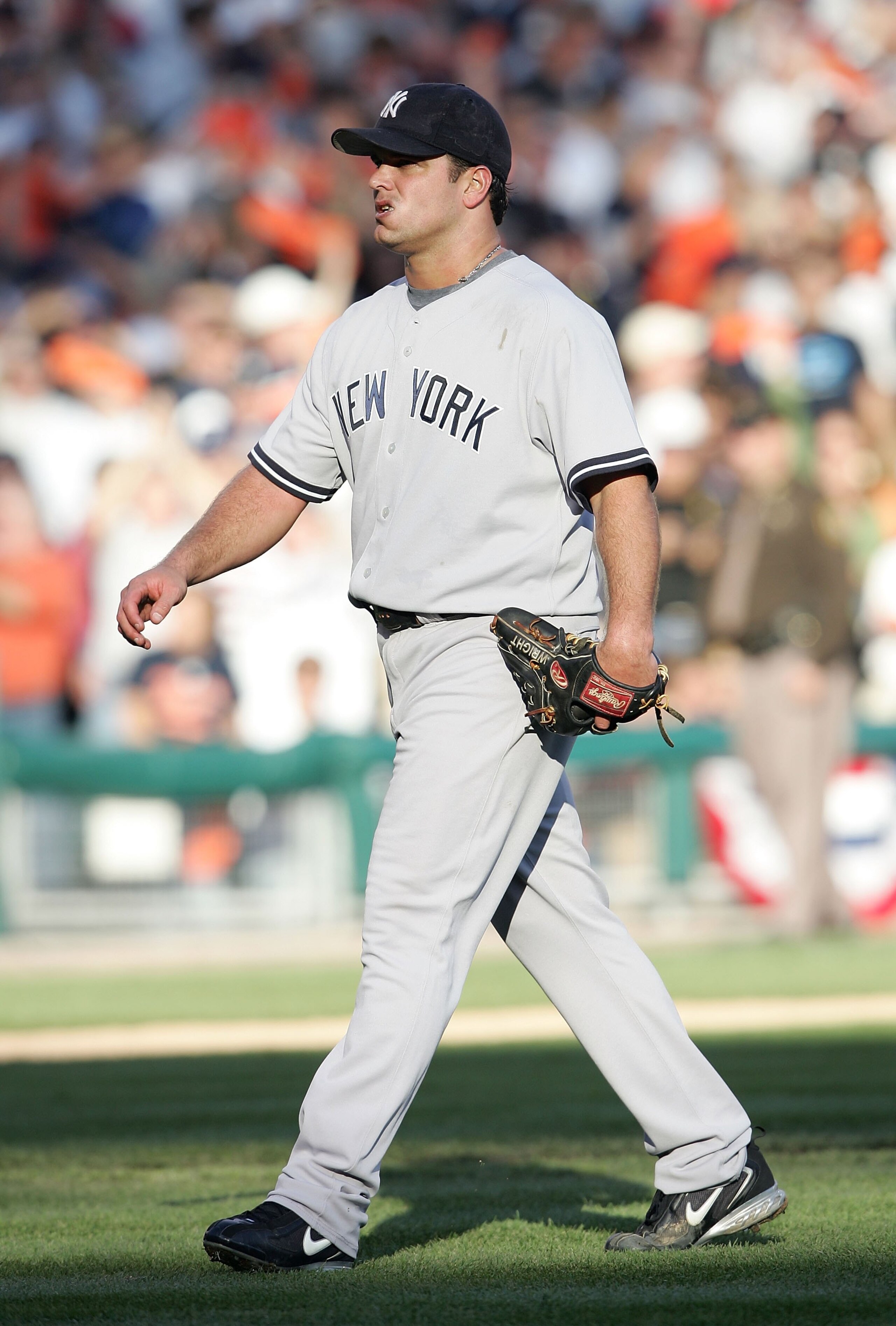 DETROIT - OCTOBER 07:  Starting pitcher Jaret Wright #34 of the New York Yankees walks to the dugout after he was taken out of the game in the third inning against the Detroit Tigers during Game Four of the 2006 American League Division Series on October 
