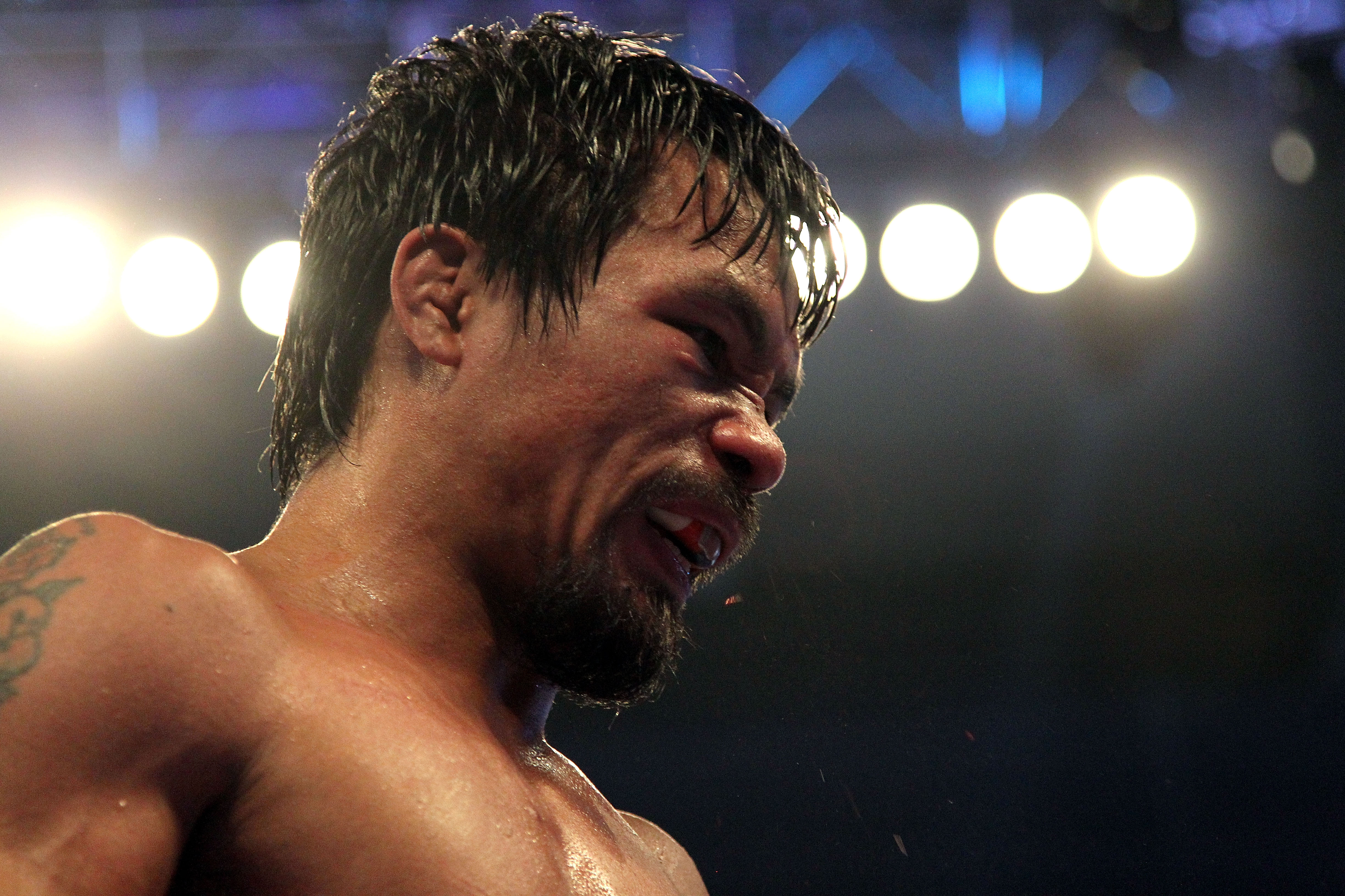 ARLINGTON, TX - MARCH 13:  Manny Pacquiao of the Philippines looks on in the ring against Joshua Clottey of Ghana during the WBO welterweight title fight at Cowboys Stadium on March 13, 2010 in Arlington, Texas. Pacquiao defeated Clottey by unanimous deci