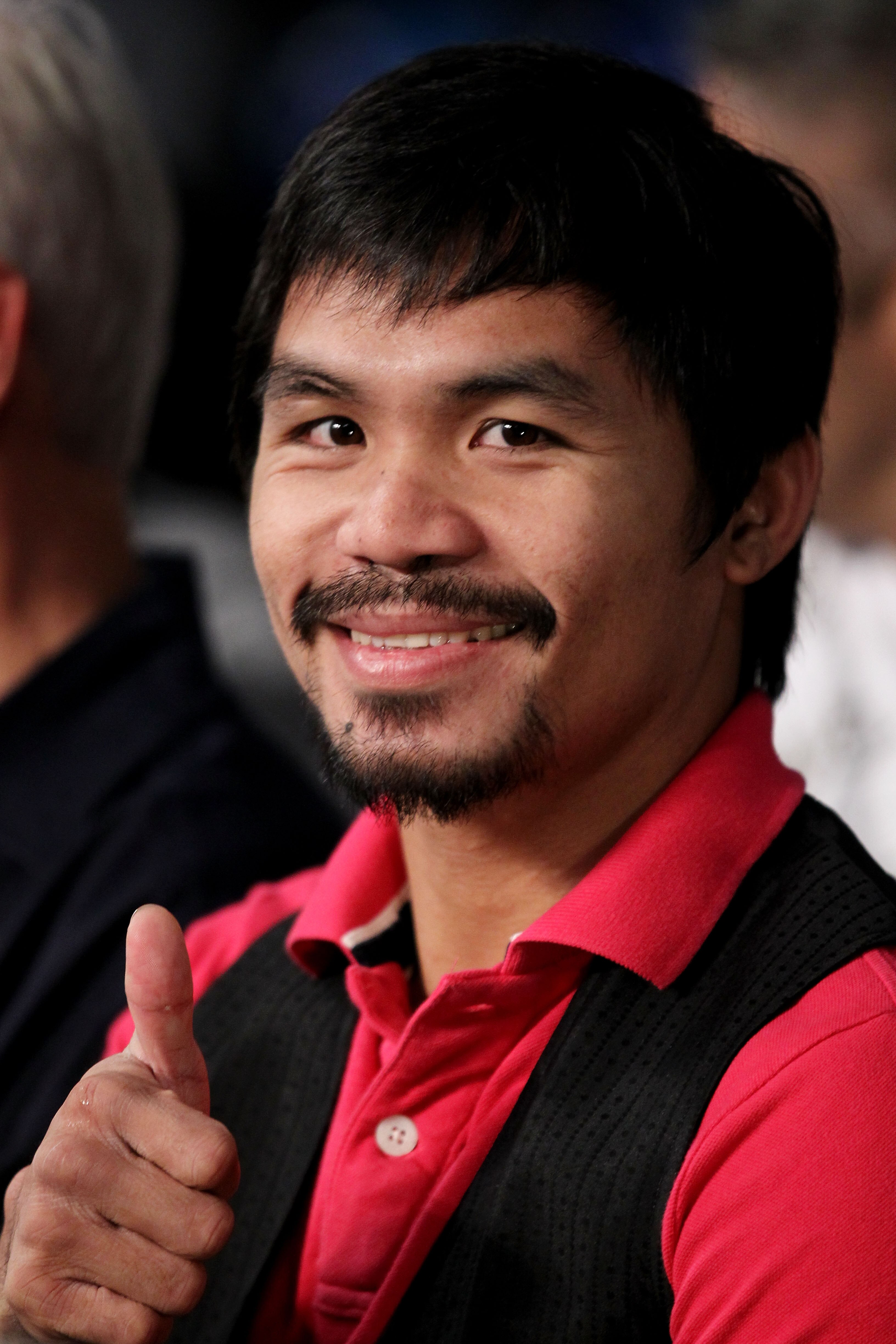 NEW YORK - JUNE 05:  Professional boxer Manny Pacquiao watches the bout between Yuri Foreman and Miguel Cotto of Puerto Rico in the WBA world super welterweight title fight on June 5, 2010 at Yankee Stadium in the Bronx borough of New York City. Cotto win