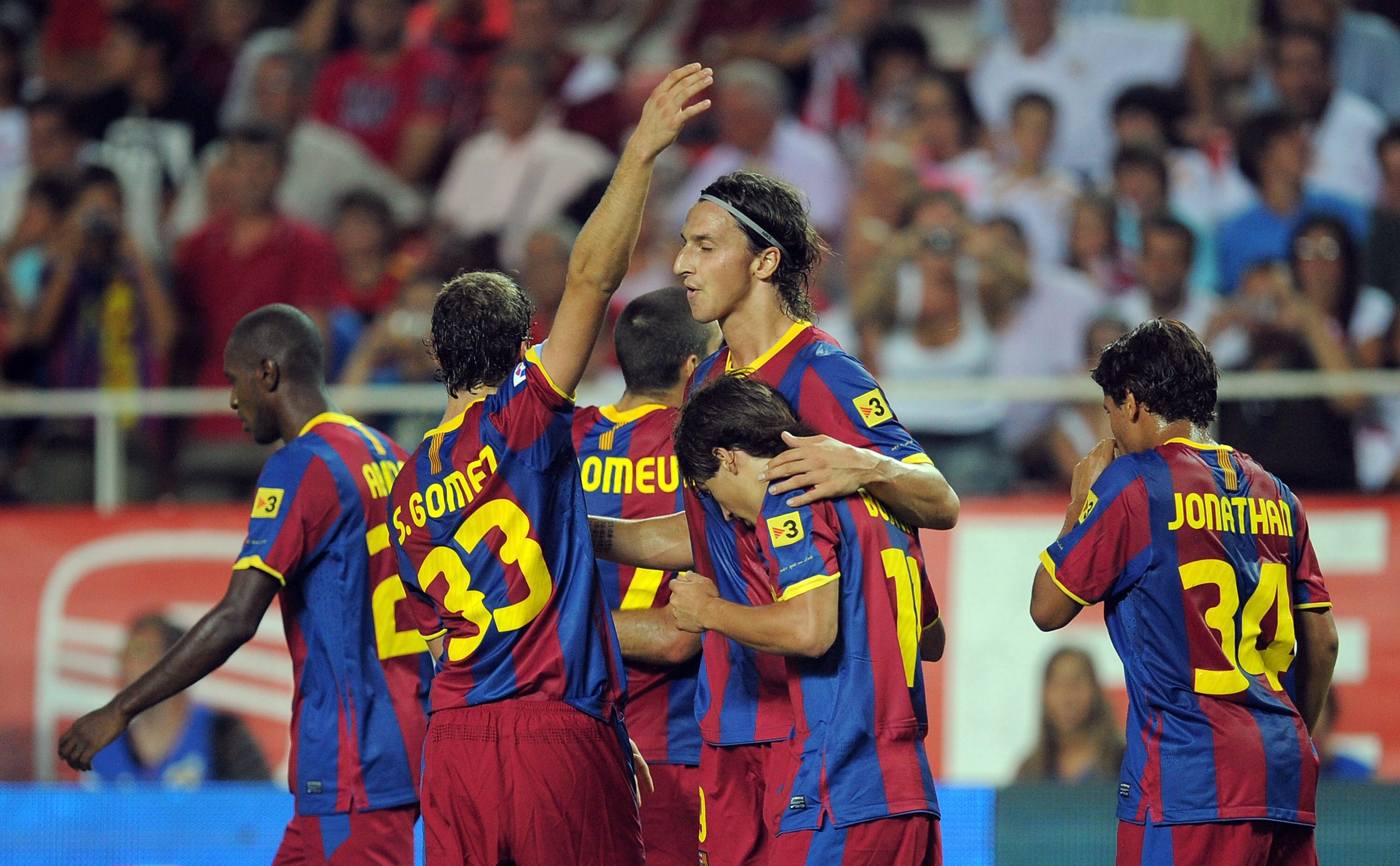 SEVILLE, SPAIN - AUGUST 14:  : Zlatan Ibrahimovic (C) of Barcelona celebrates with teammates after scoring a goal during the Supercopa, first leg, match between Sevilla and Barcelona at the Sanchez Pizjuan stadium  on August 14, 2010 in Seville, Spain.  (