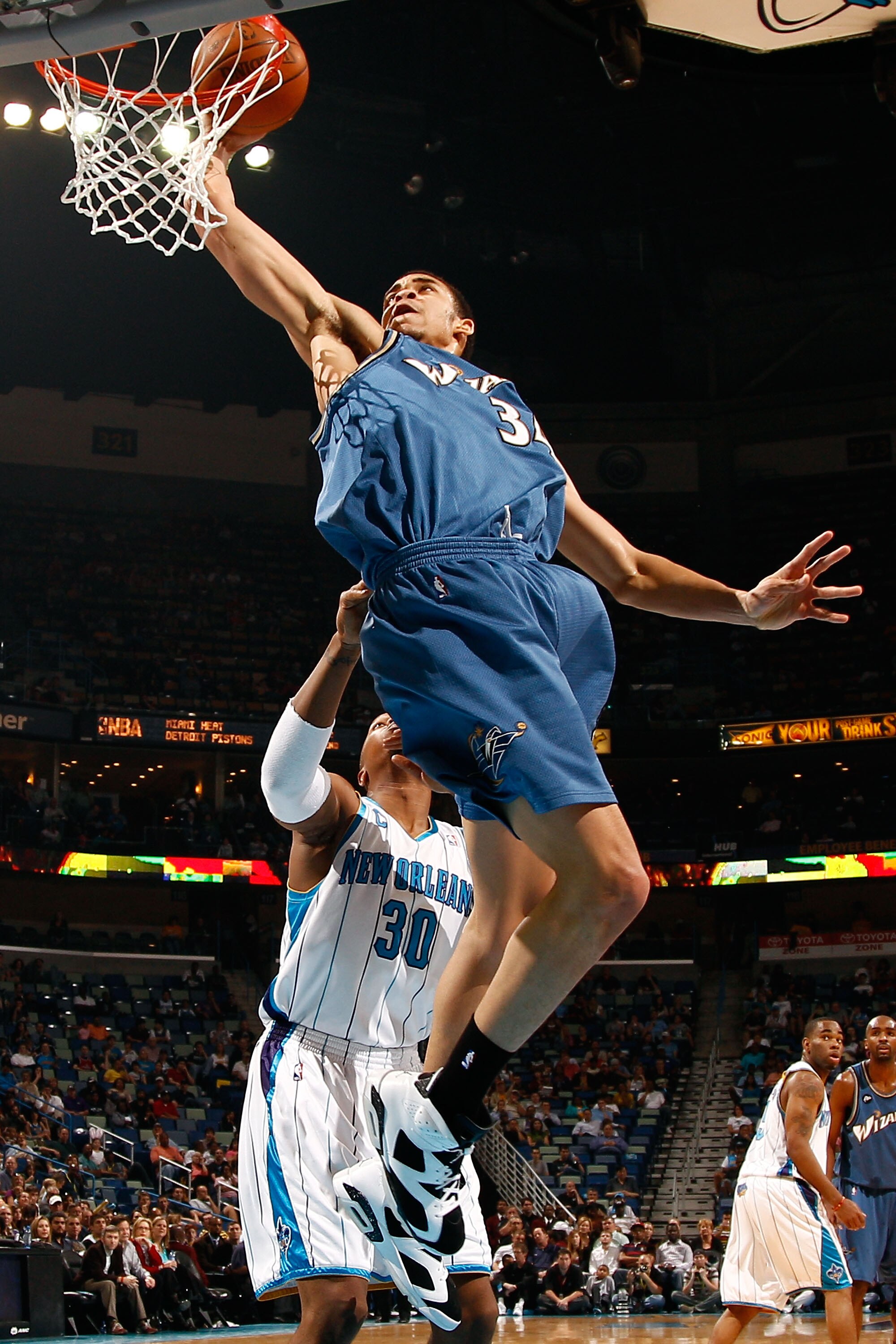 NEW ORLEANS - MARCH 31:  JaVale McGee #34 of the Washington Wizards attempts a shot over David West #30 of the New Orleans Hornets at New Orleans Arena on March 31, 2010 in New Orleans, Louisiana.  NOTE TO USER: User expressly acknowledges and agrees that