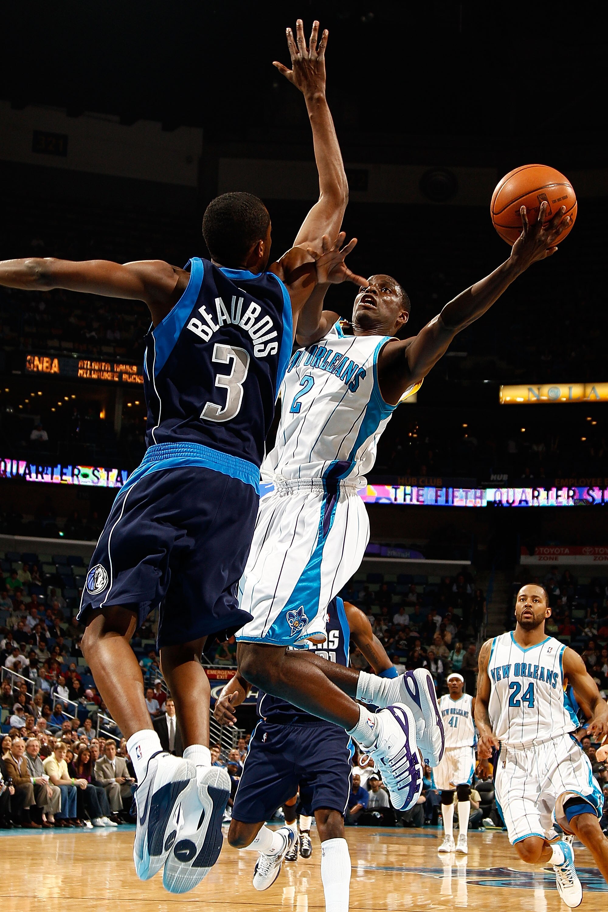 NEW ORLEANS - MARCH 22:  Darren Collison #2 of the New Orleans Hornets shoots the ball around Rodrigue Beaubois #3 of the Dallas Mavericks at the New Orleans Arena on March 22, 2010 in New Orleans, Louisiana.  NOTE TO USER: User expressly acknowledges and