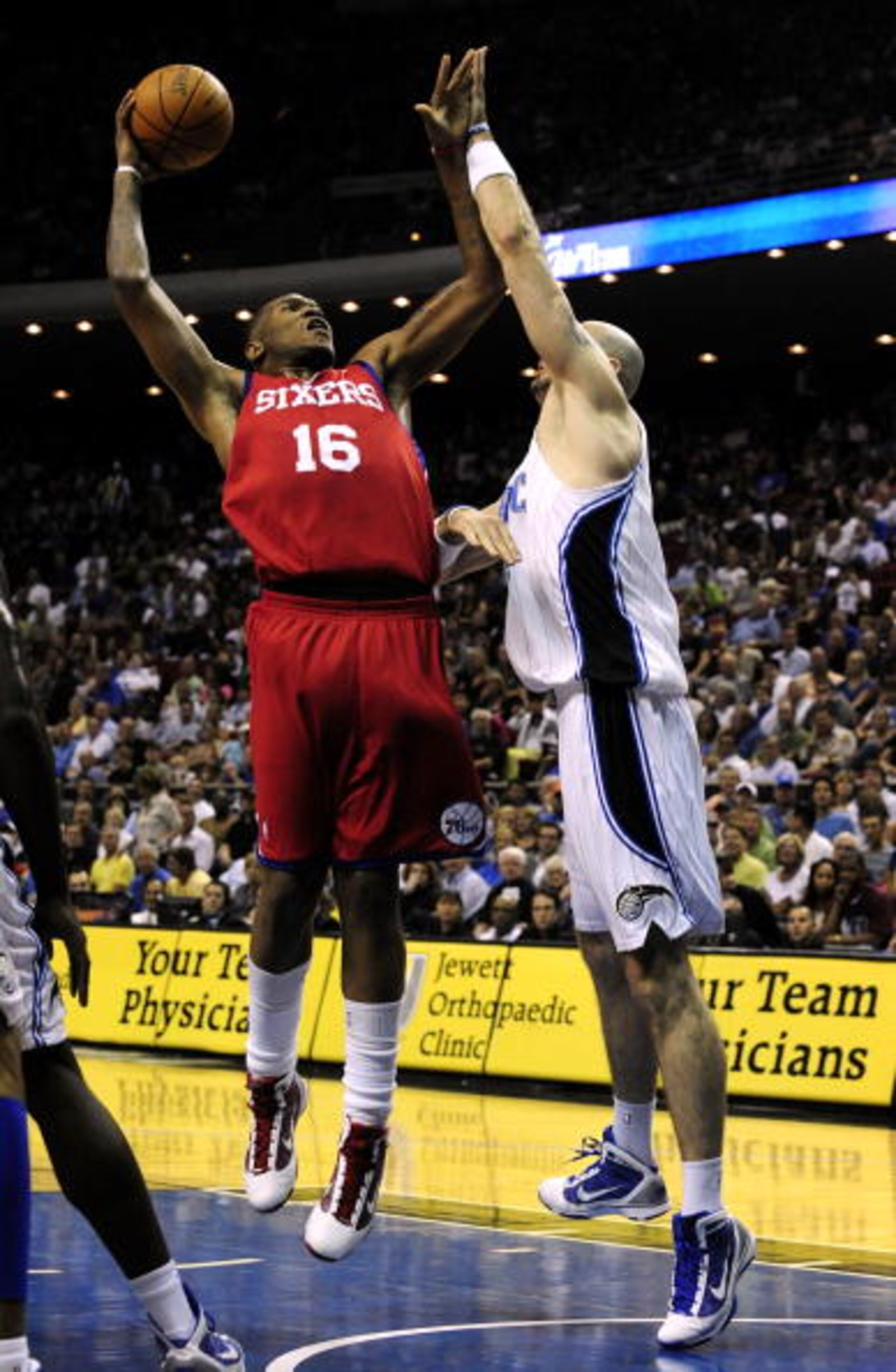 ORLANDO, FL - OCTOBER 28: Marreese Speights #16 of the Philadelphia 76ers goes up for a shot against Marcin Gortat #13 of the Orlando Magic during the game on October 28, 2009 at Amway Arena in Orlando, Florida. NOTE TO USER: User expressly acknowledges ORLANDO, FL - OCTOBER 28: Marreese Speights #16 of the Philadelphia 76ers goes up for a shot against Marcin Gortat #13 of the Orlando Magic during the game on October 28, 2009 at Amway Arena in Orlando, Florida. NOTE TO USER: User expressly acknowledges