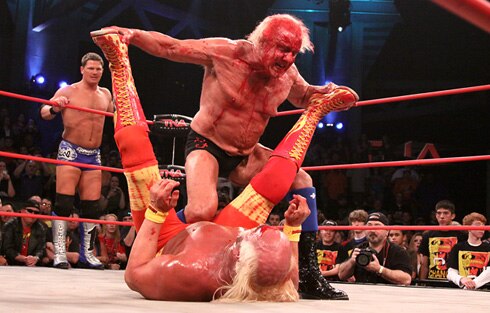 Flair beating up Hulkster for making him come to TNA