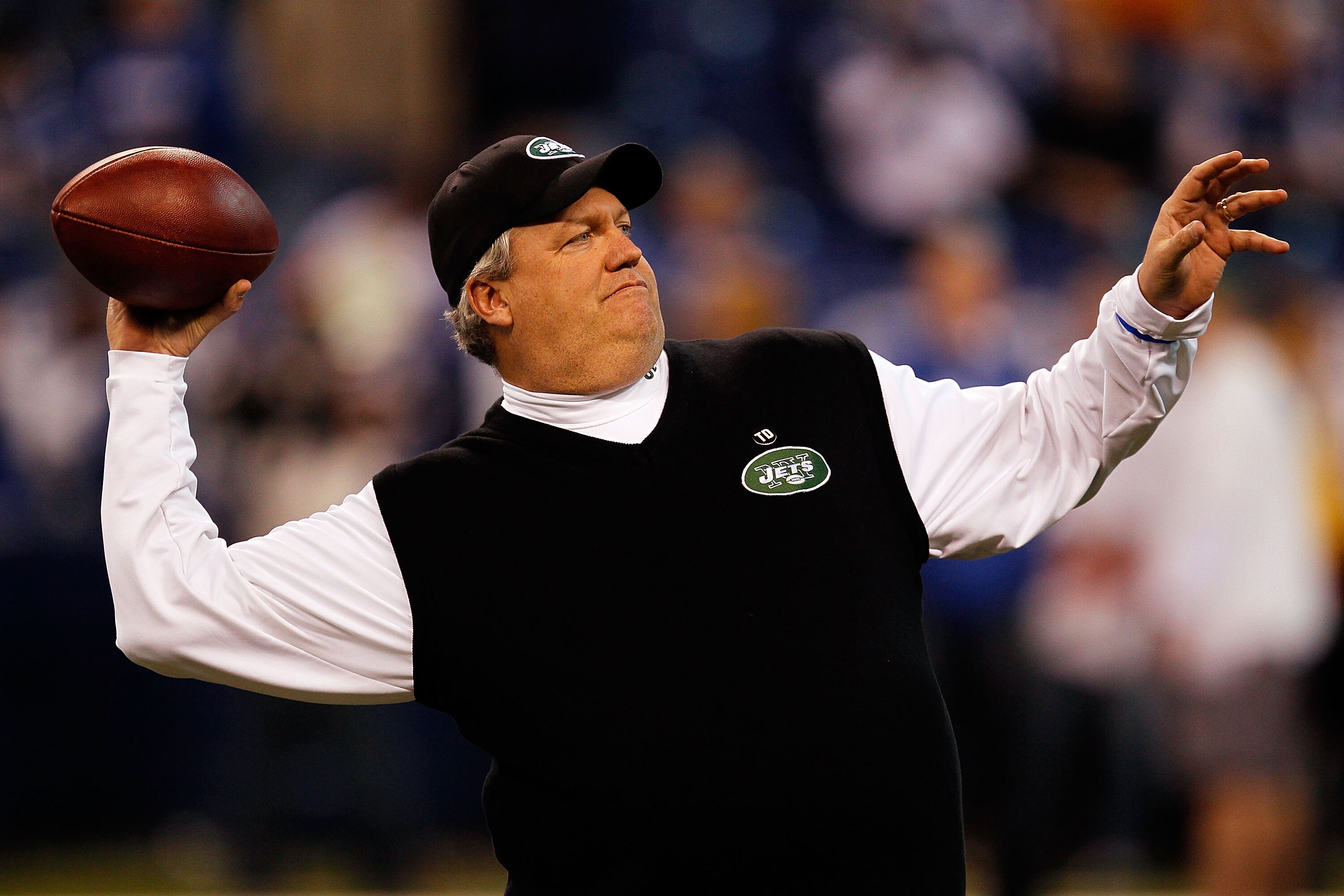 INDIANAPOLIS - JANUARY 24:  Rex Ryan, head coach of the New York Jets, throws a pass during warm-ups before playing against the Indianapolis Colts during the AFC Championship Game at Lucas Oil Stadium on January 24, 2010 in Indianapolis, Indiana.  (Photo