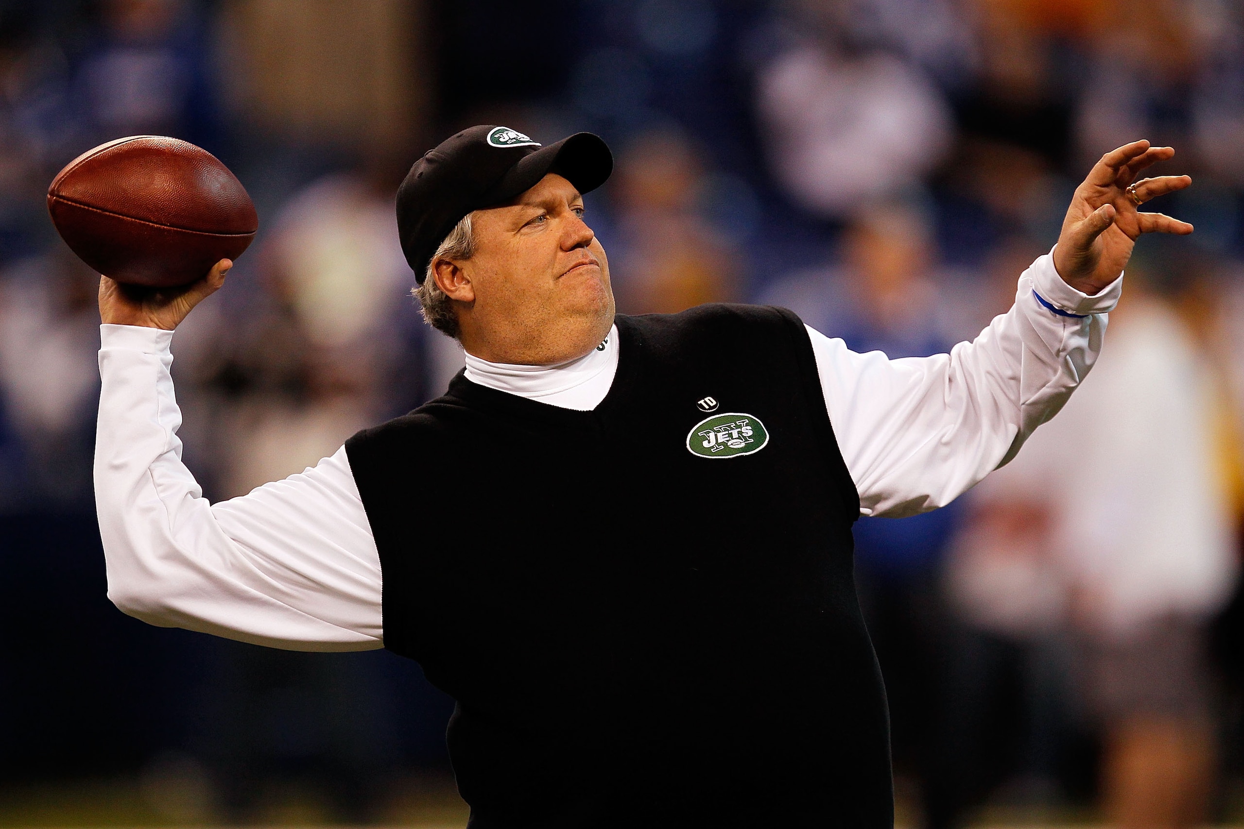INDIANAPOLIS - JANUARY 24:  Rex Ryan, head coach of the New York Jets, throws a pass during warm-ups before playing against the Indianapolis Colts during the AFC Championship Game at Lucas Oil Stadium on January 24, 2010 in Indianapolis, Indiana.  (Photo