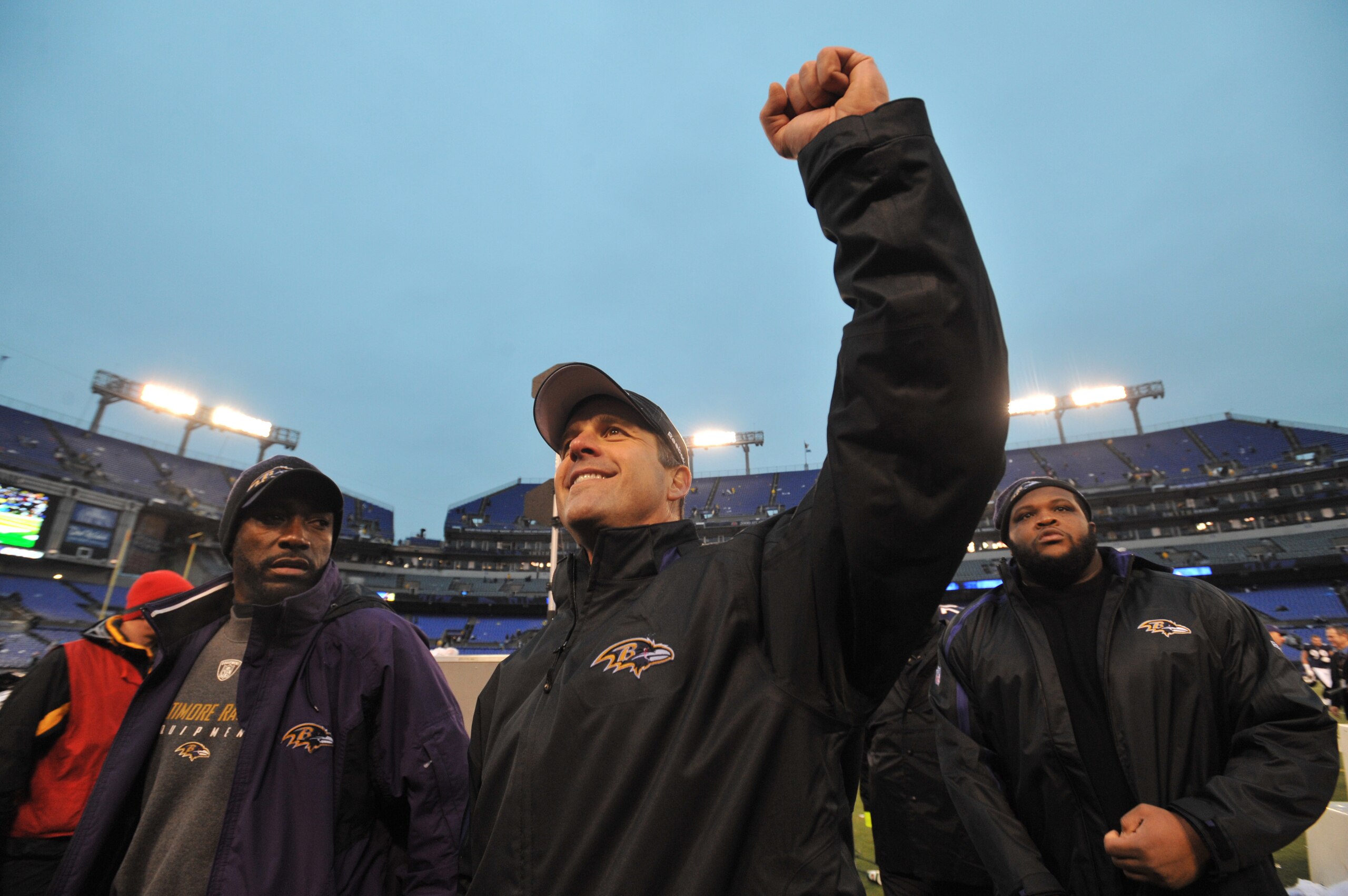 BALTIMORE - DECEMBER 13:  Head coach John Harbaugh of the Baltimore Ravens walks triumphantly off the field after the game against the Detroit Lions at M&T Bank Stadium on December 13, 2009 in Baltimore, Maryland. The Ravens defeated the Lions 48-3. (Phot