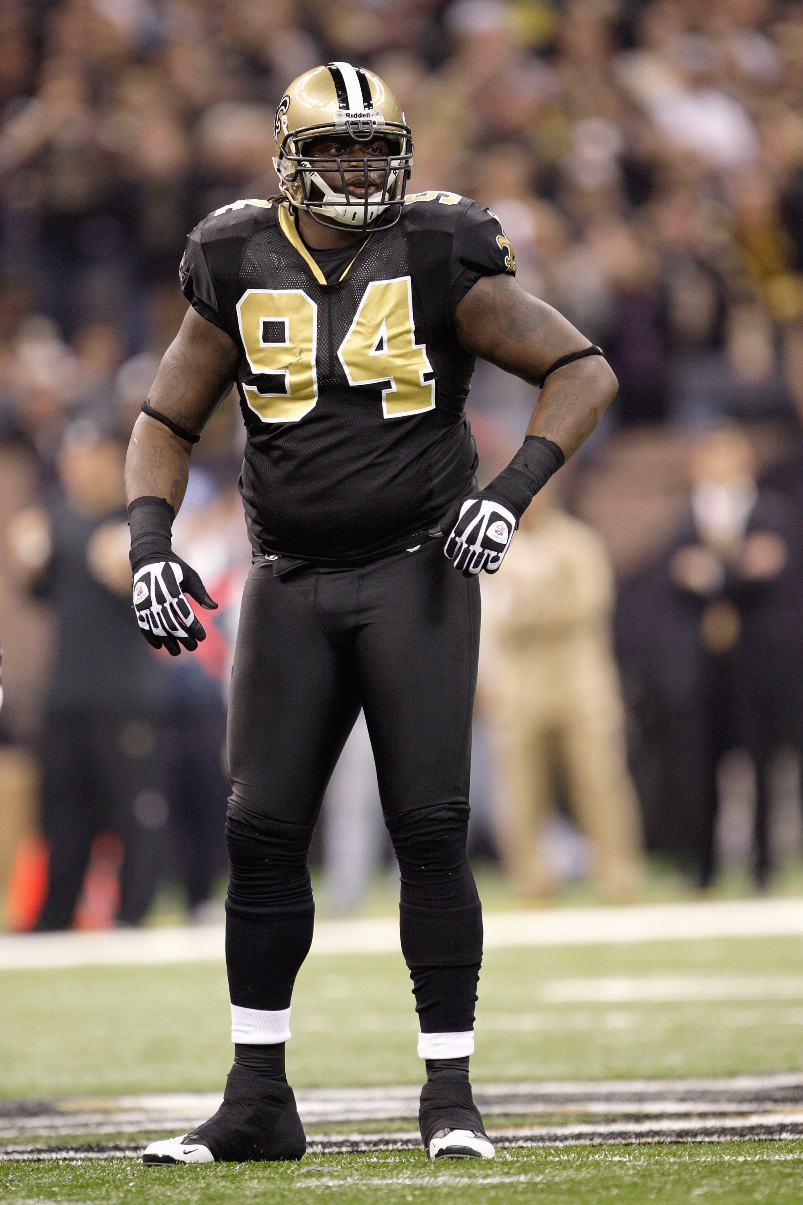 NEW ORLEANS - DECEMBER 27: Charles Grant #94 of the New Orleans Saints stands on the field during the game against the Tampa Bay Buccaneers on December 27, 2009 at Louisiana Superdome in New Orleans, Louisiana. (Photo by Jamie Squire/Getty Images)