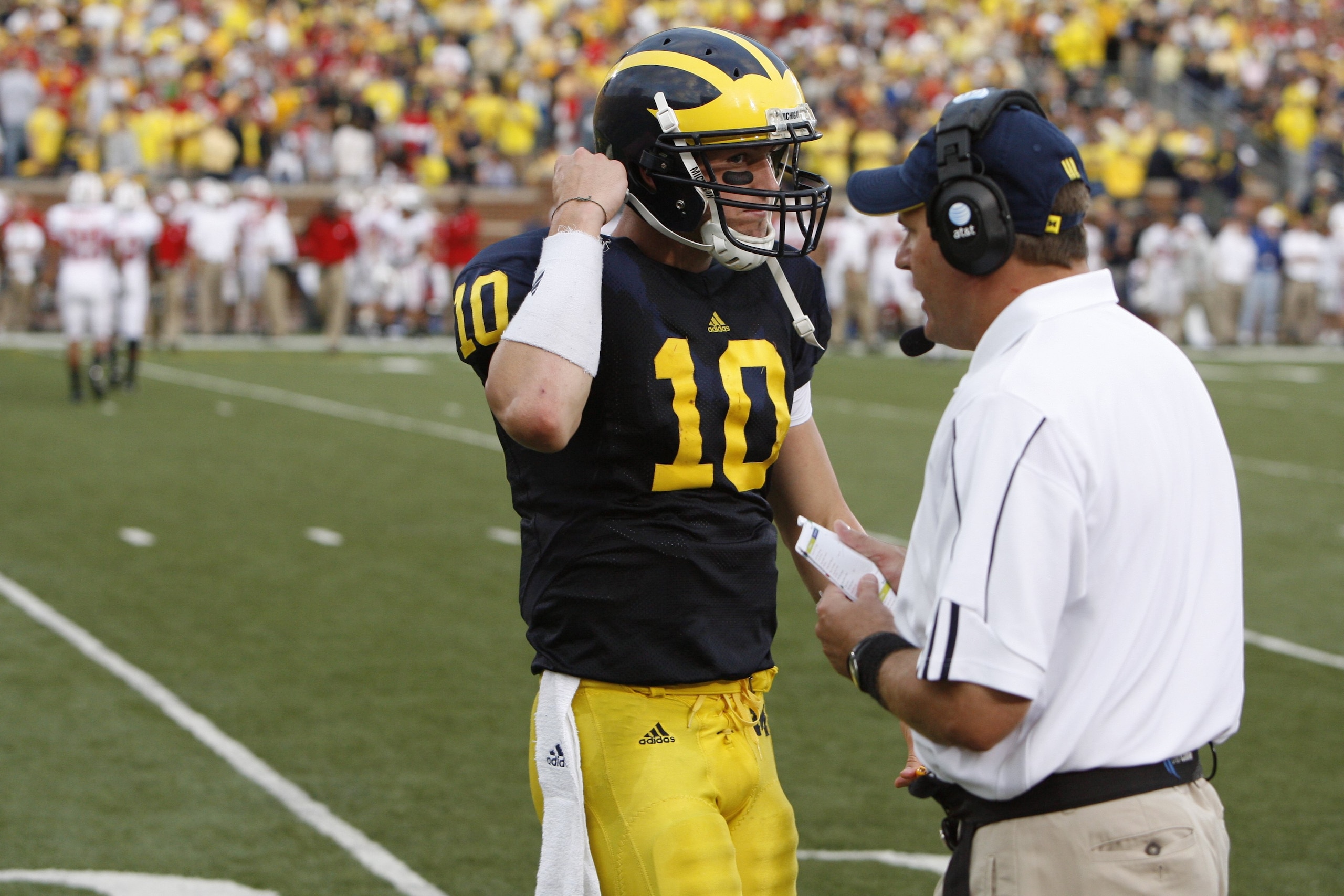 ANN ARBOR, MI - SEPTEMBER 27:  Steven Threet #10 of the Michigan Wolverines walks toward head coach Rich Rodriguez during the game against the Wisconsin Badgers on September 27, 2008 at Michigan Stadium in Ann Arbor, Michigan. (Photo by Gregory Shamus/Get