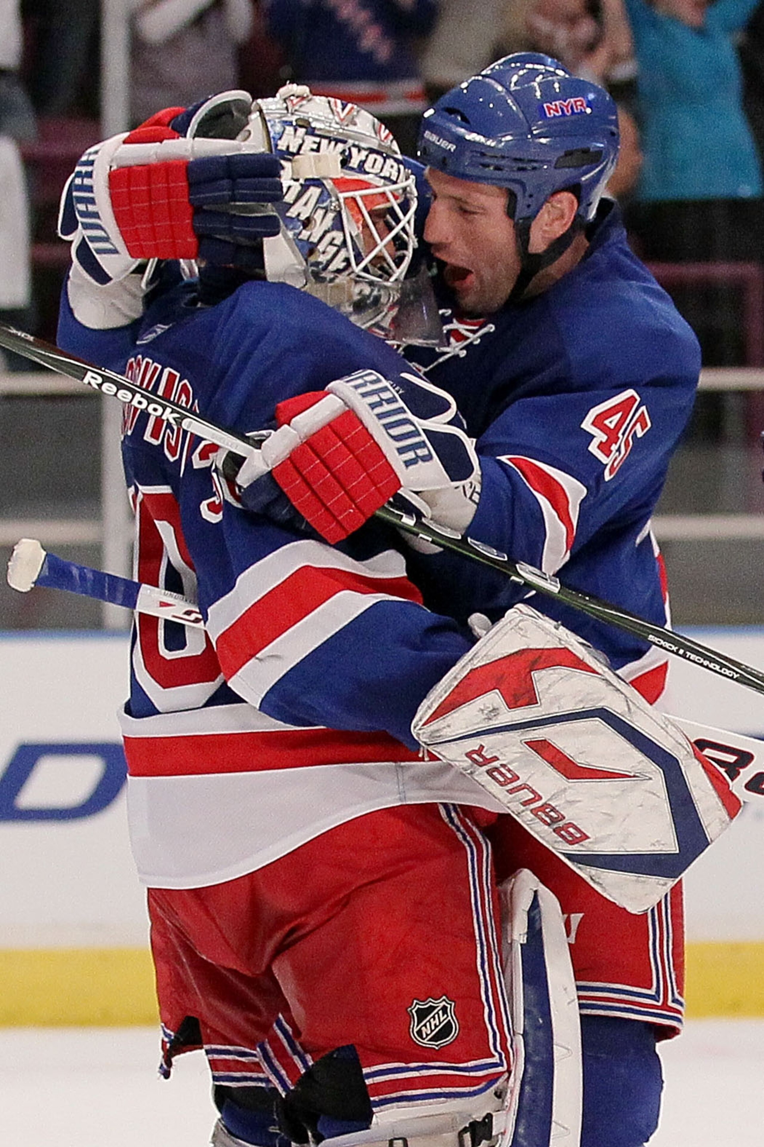 NEW YORK - APRIL 09: Henrik Lundqvist #30 of the New York Rangers celebrates victory with team mate Jody Shelley #45 against the Philadelphia Flyers during their game on April 9, 2010 at Madison Square Garden in New York City.  (Photo by Chris McGrath/Get