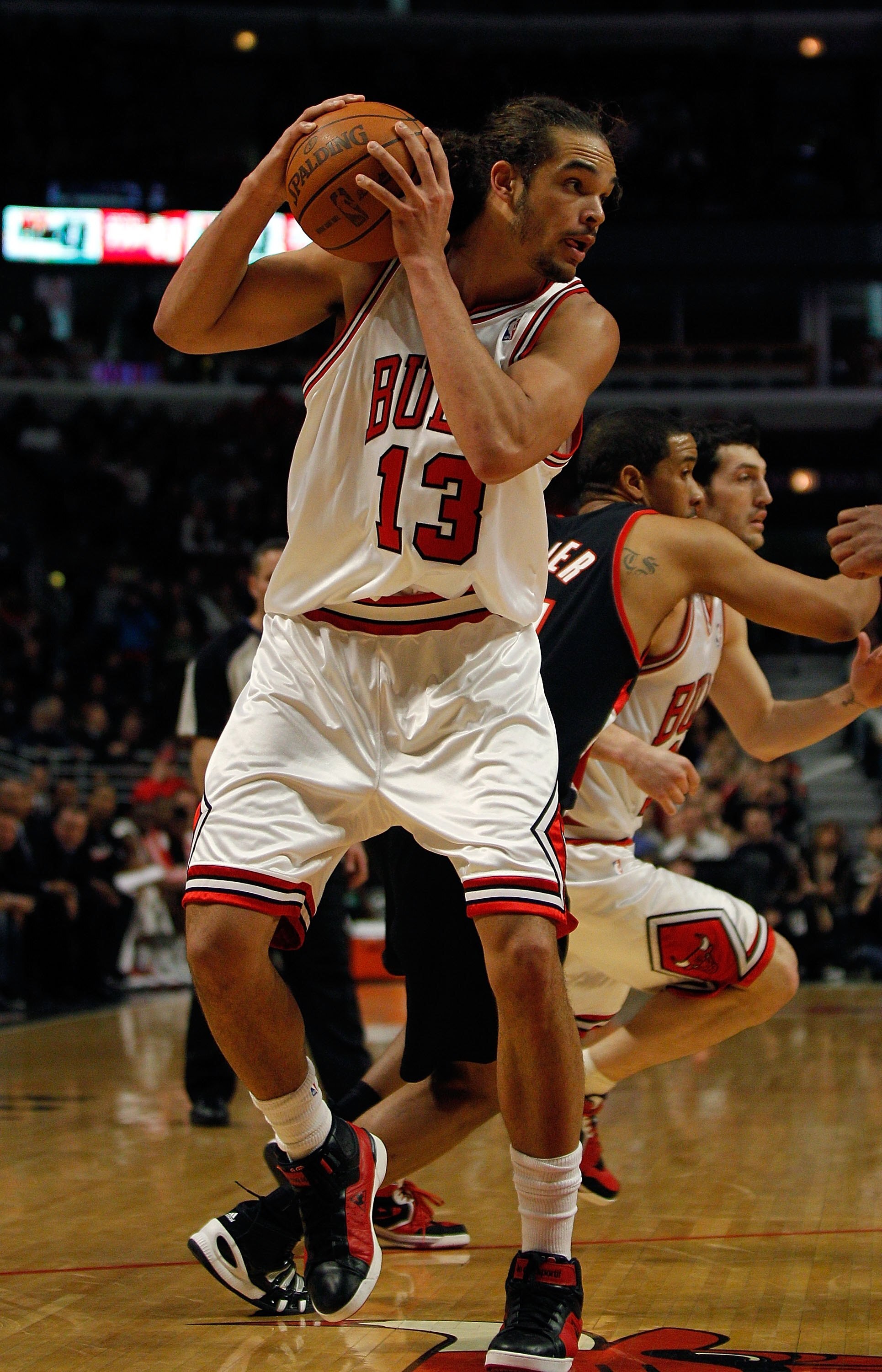 CHICAGO - FEBRUARY 26: Joakim Noah #13 of the Chicago Bulls looks to pass against the Portland Trail Blazers at the United Center on February 26, 2010 in Chicago, Illinois. The Bulls defeated the Trail Blazers 115-111 in overtime. NOTE TO USER: User expre