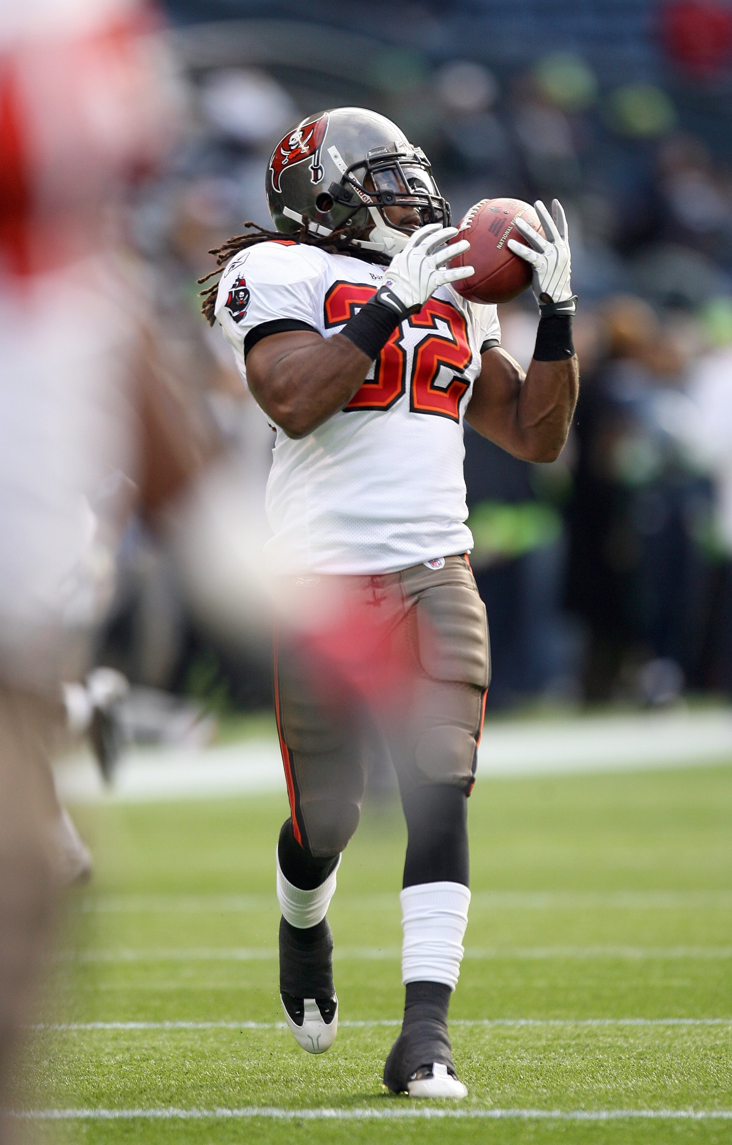 SEATTLE - DECEMBER 20: Kareem Huggins #32 of the Tampa Bay Buccaneers warms up prior to their game against the Seattle Seahawks on December 20, 2009 at Qwest Field in Seattle, Washington. The Buccaneers defeated the Seahawks 24-7. (Photo by Otto Greule J SEATTLE - DECEMBER 20: Kareem Huggins #32 of the Tampa Bay Buccaneers warms up prior to their game against the Seattle Seahawks on December 20, 2009 at Qwest Field in Seattle, Washington. The Buccaneers defeated the Seahawks 24-7. (Photo by Otto Greule J