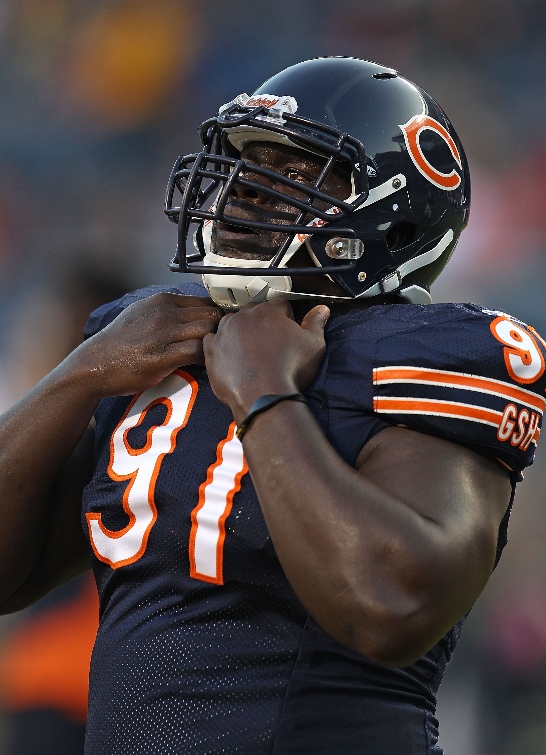 CHICAGO - AUGUST 21:  Tommie Harris #91 of the Chicago Bears warms-up before a preseason game against the Oakland Raiders at Soldier Field on August 21, 2010 in Chicago, Illinois. The Raiders defeated the Bears 32-17.  (Photo by Jonathan Daniel/Getty Imag