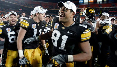 Iowa Hawkeyes celebrating victory in Orange Bowl.