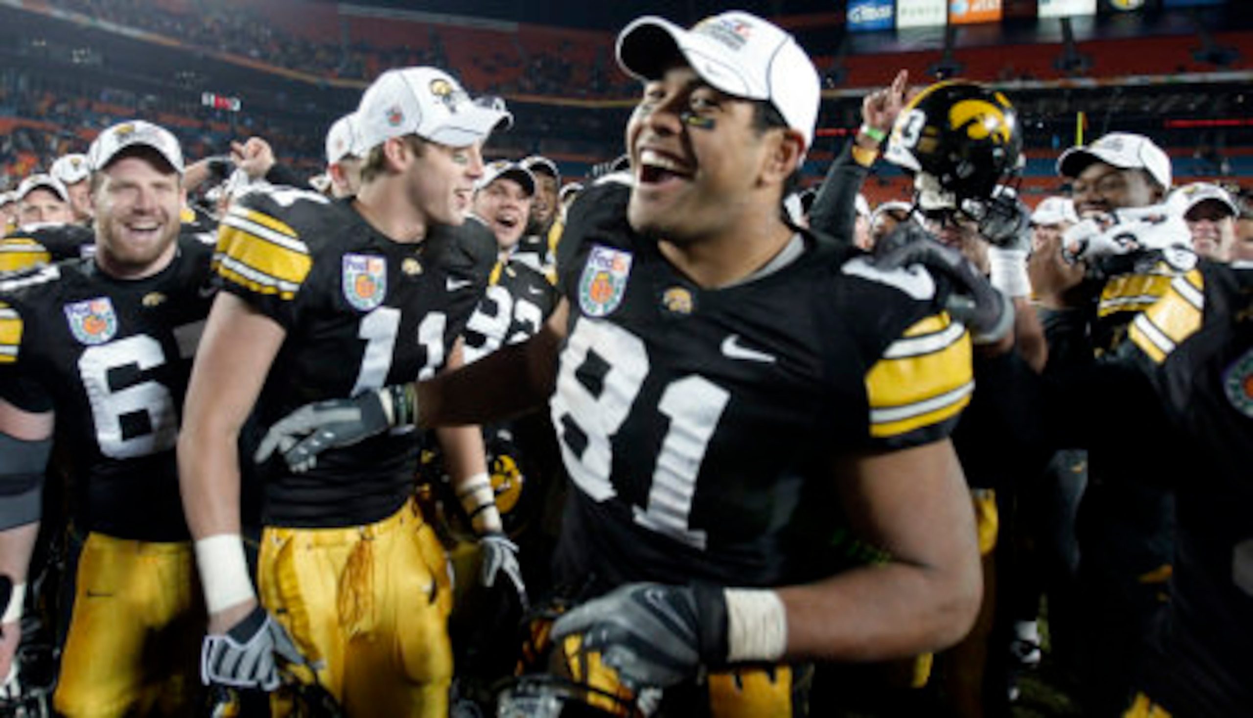 Iowa Hawkeyes celebrating victory in Orange Bowl.