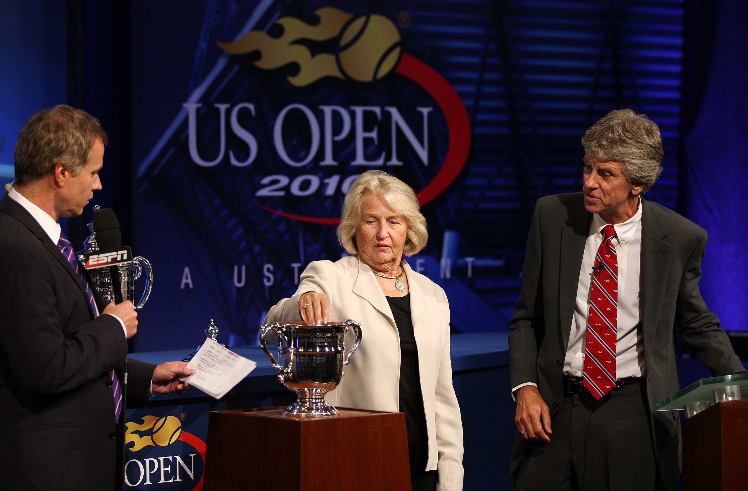 NEW YORK - AUGUST 26:  Former professional tennis player Patrick McEnroe, USTA President Lucy Garvin and U.S. Open Referee Brian Earley participate in the Draw Ceremony prior to the start of the 2010 U.S. Open at the USTA Billie Jean King National Tennis