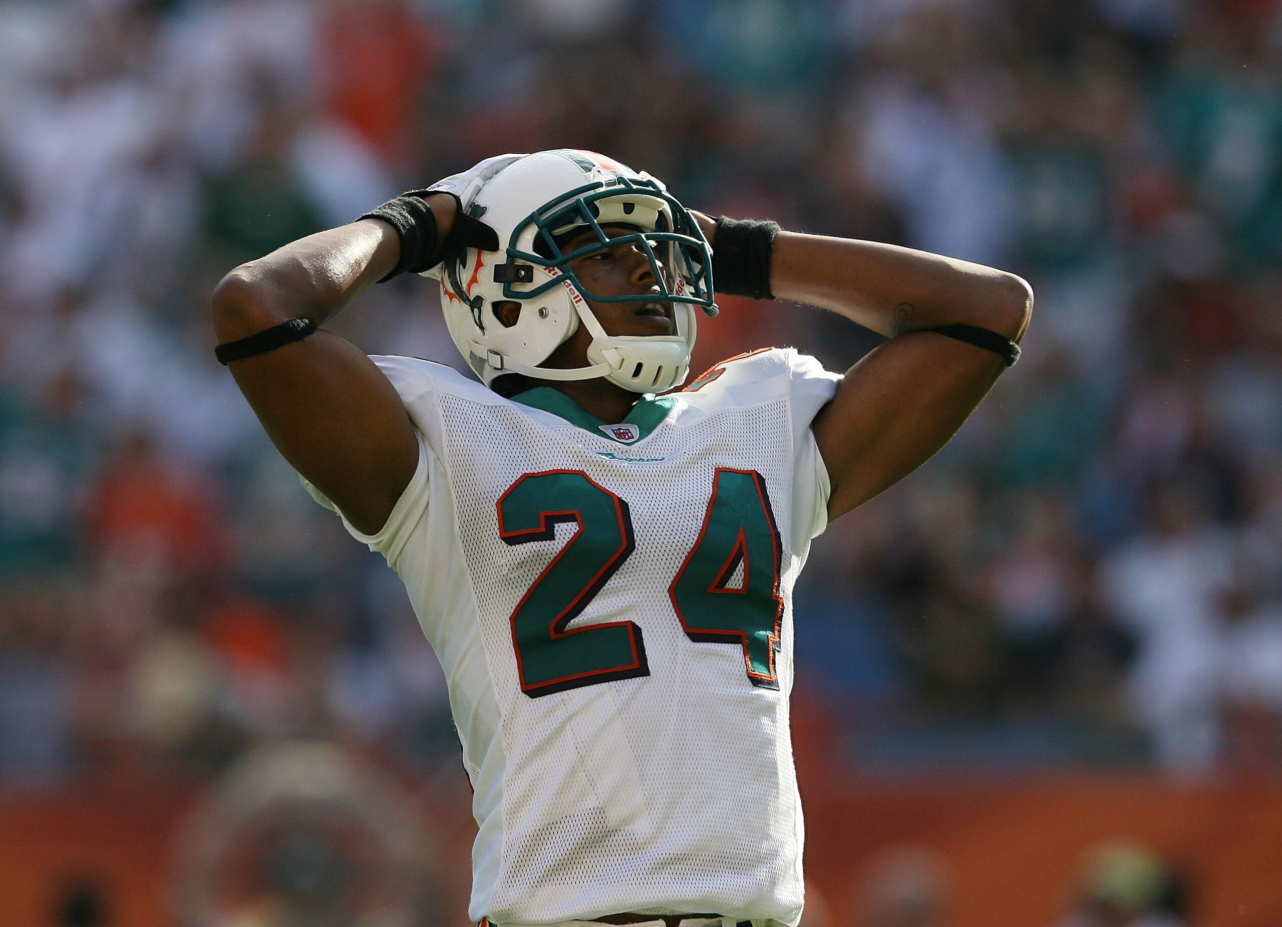 MIAMI - DECEMBER 27:  Cornerback Sean Smith #24 of the Miami Dolphins reacts after safety Gibril Wilson #28 dropped an interception that was deflected against the Houston Texans at Land Shark Stadium on December 27, 2009 in Miami, Florida. The Texans defe