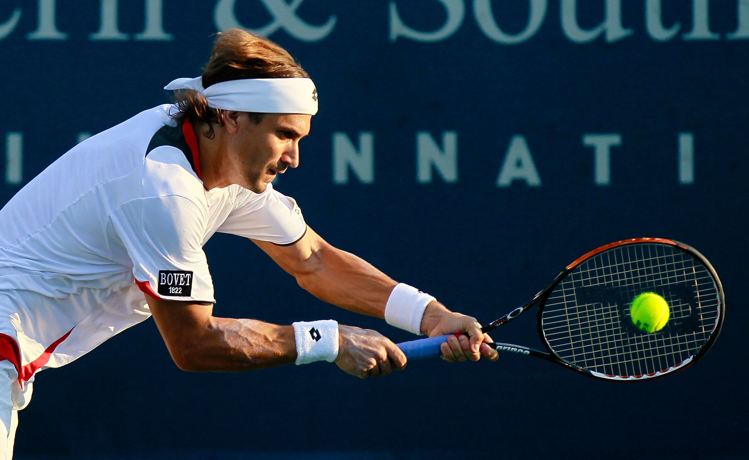 CINCINNATI - AUGUST 19:  David Ferrer of Spain returns a backhand to Nikolay Davydenko of Russia during Day 4 of the Western & Southern Financial Group Masters at the Lindner Family Tennis Center on August 19, 2010 in Cincinnati, Ohio.  (Photo by Kevin C.