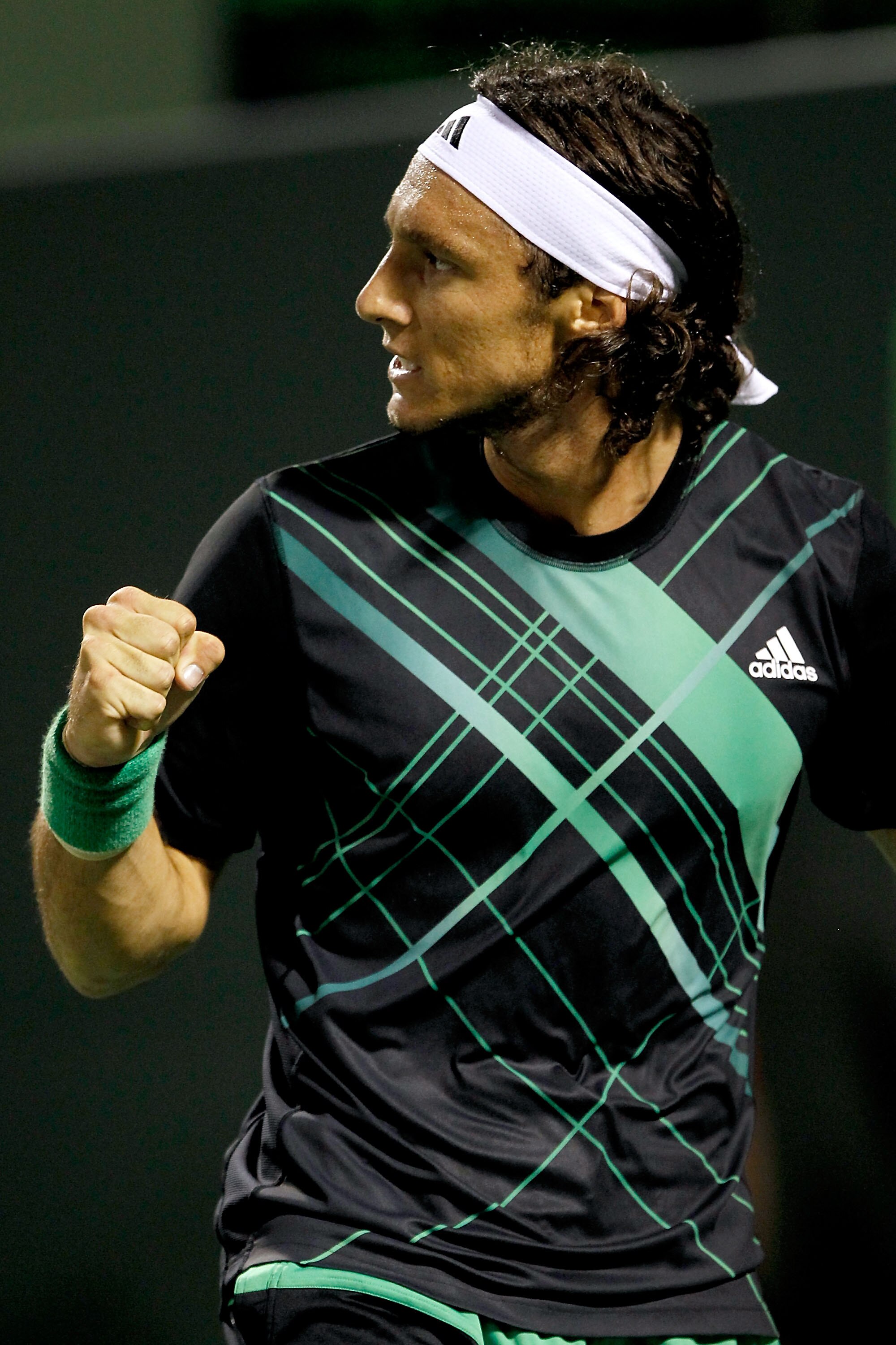 KEY BISCAYNE, FL - MARCH 29:  Juan Monaco of Argentina celebrates breaking Fernando Gonzalez of Chile in the first set during day seven of the 2010 Sony Ericsson Open at Crandon Park Tennis Center on March 29, 2010 in Key Biscayne, Florida.  (Photo by Mat