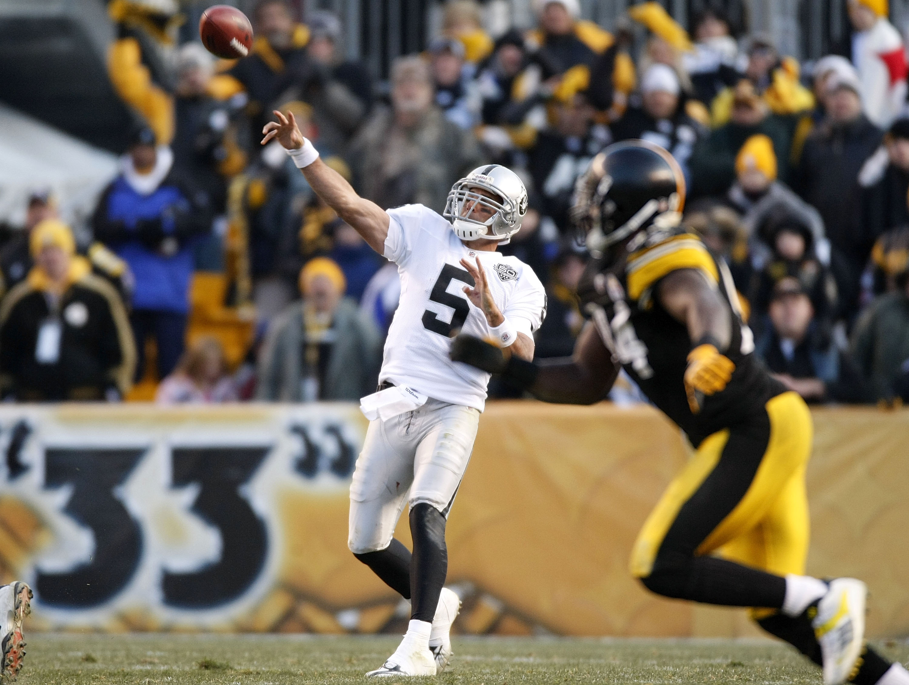 PITTSBURGH - DECEMBER 06:  Bruce Gradkowski #5 of the Oakland Raiders throws a fourth quarter pass while playing the Pittsburgh Steelers on December 6, 2009 at Heinz Field in Pittsburgh, Pennsylvania. Oakland won the game 27-24.  (Photo by Gregory Shamus/